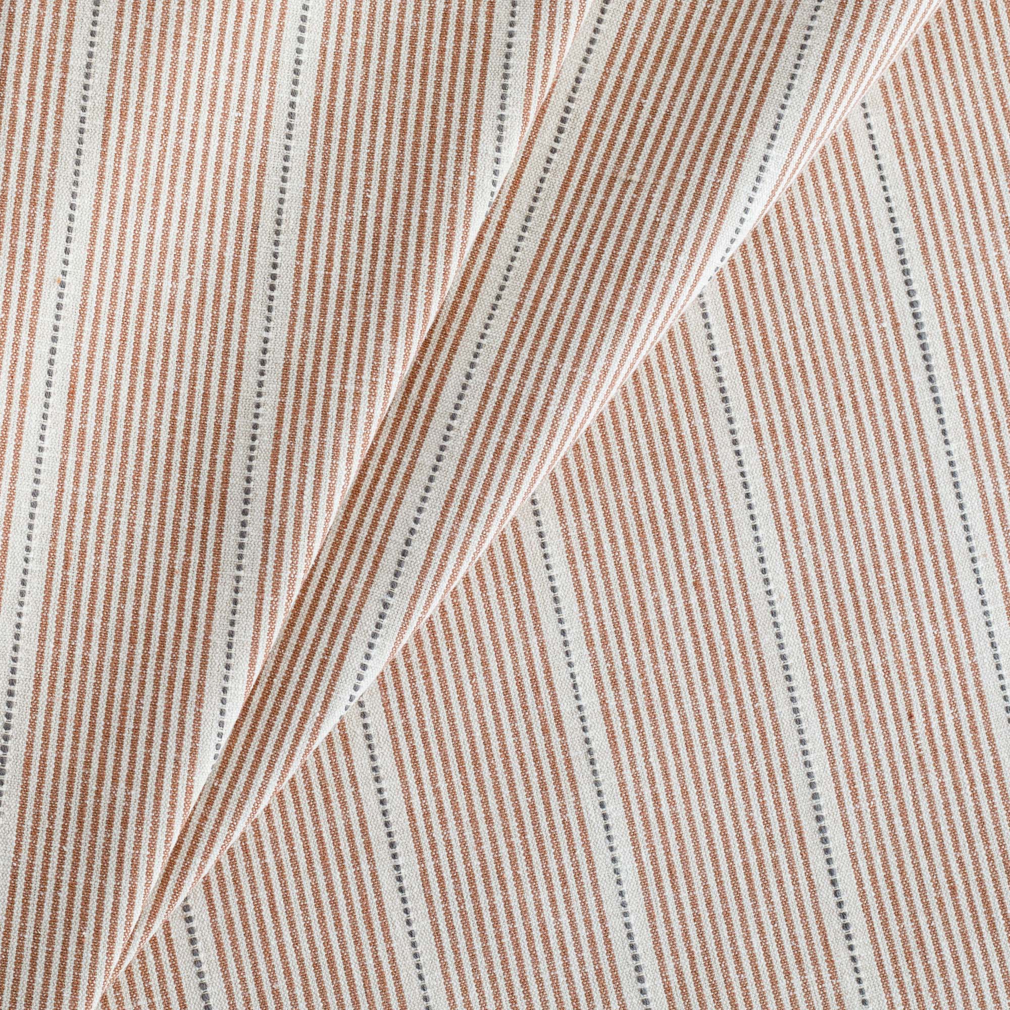 a rust red, parchment and black stripe home decor fabric from Tonic Living