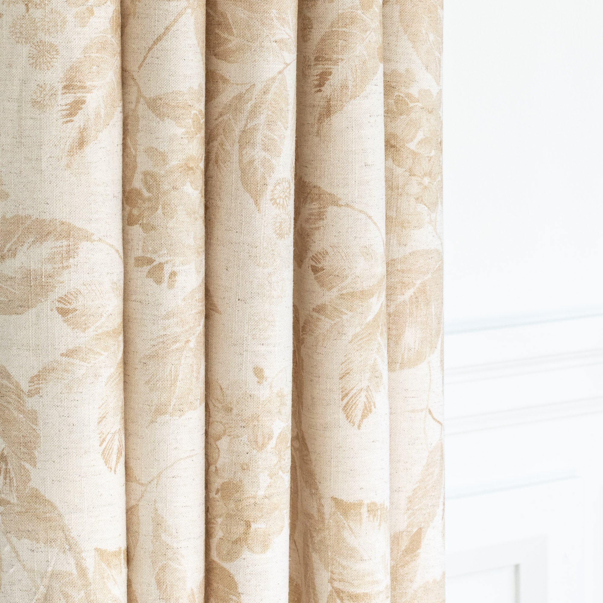 a tonal oatmeal cream and soft ochre brown floral print curtain fabric