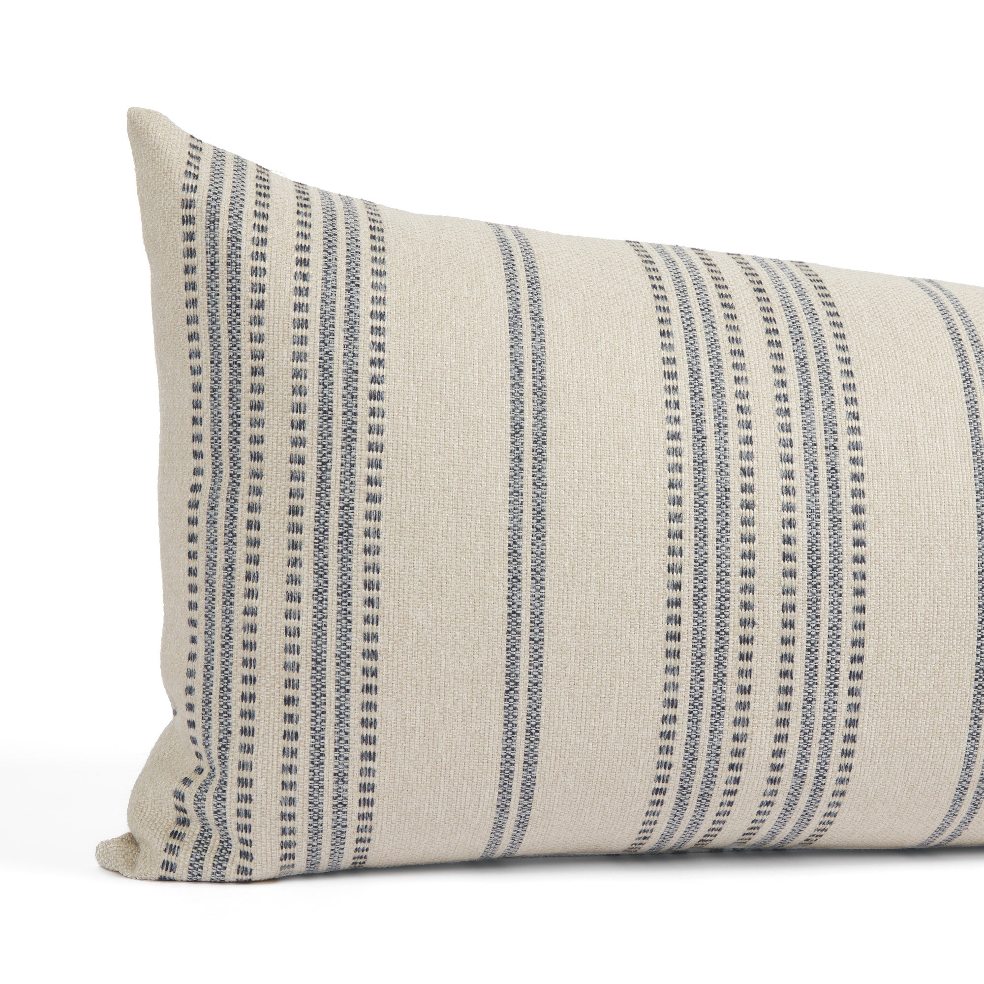 Close up of Tonic Living Hopper Stripe bed bolster showing denim blue and light tan stripe detail with dotted stitch accents.