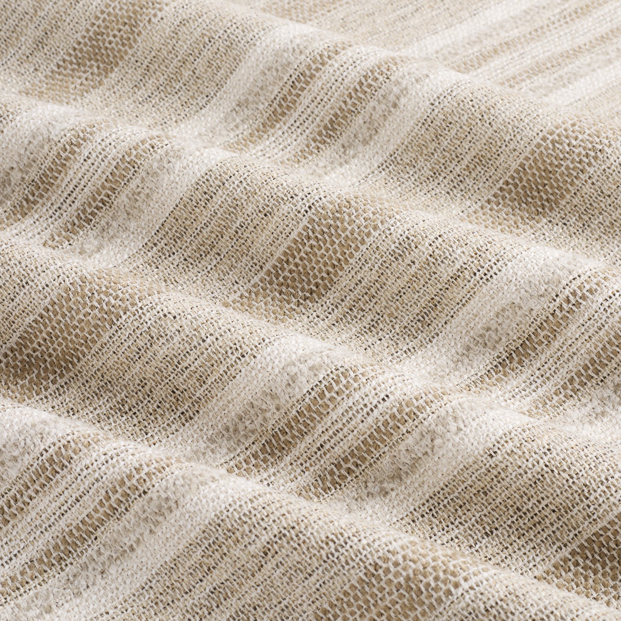 Tonic Living Indie Stripe Sand high-performance upholstery fabric in soft beige with layered stripe texture.