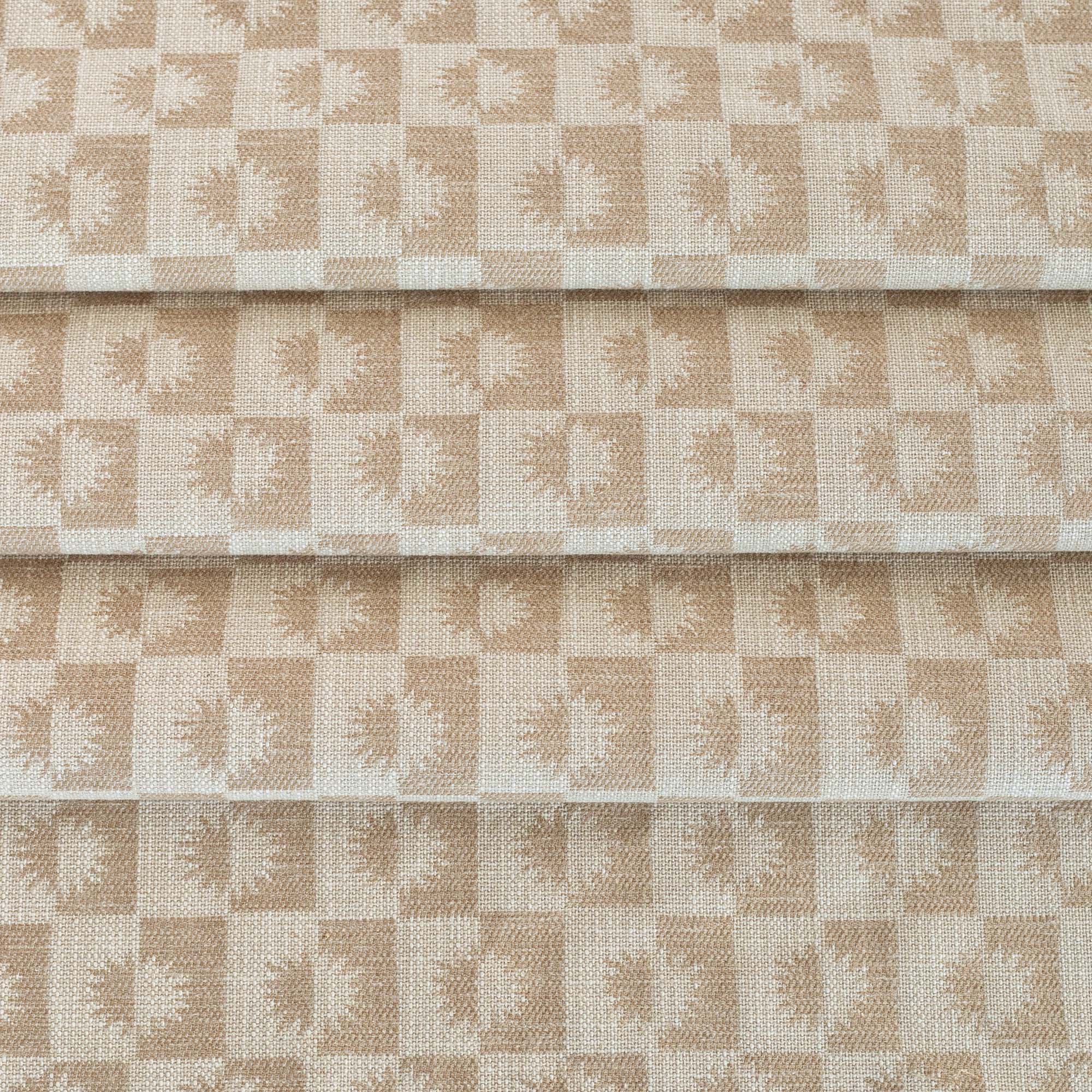 a cream and beige brown checkboard, sun motif patterned home decor  upholstery fabric from Tonic Living 