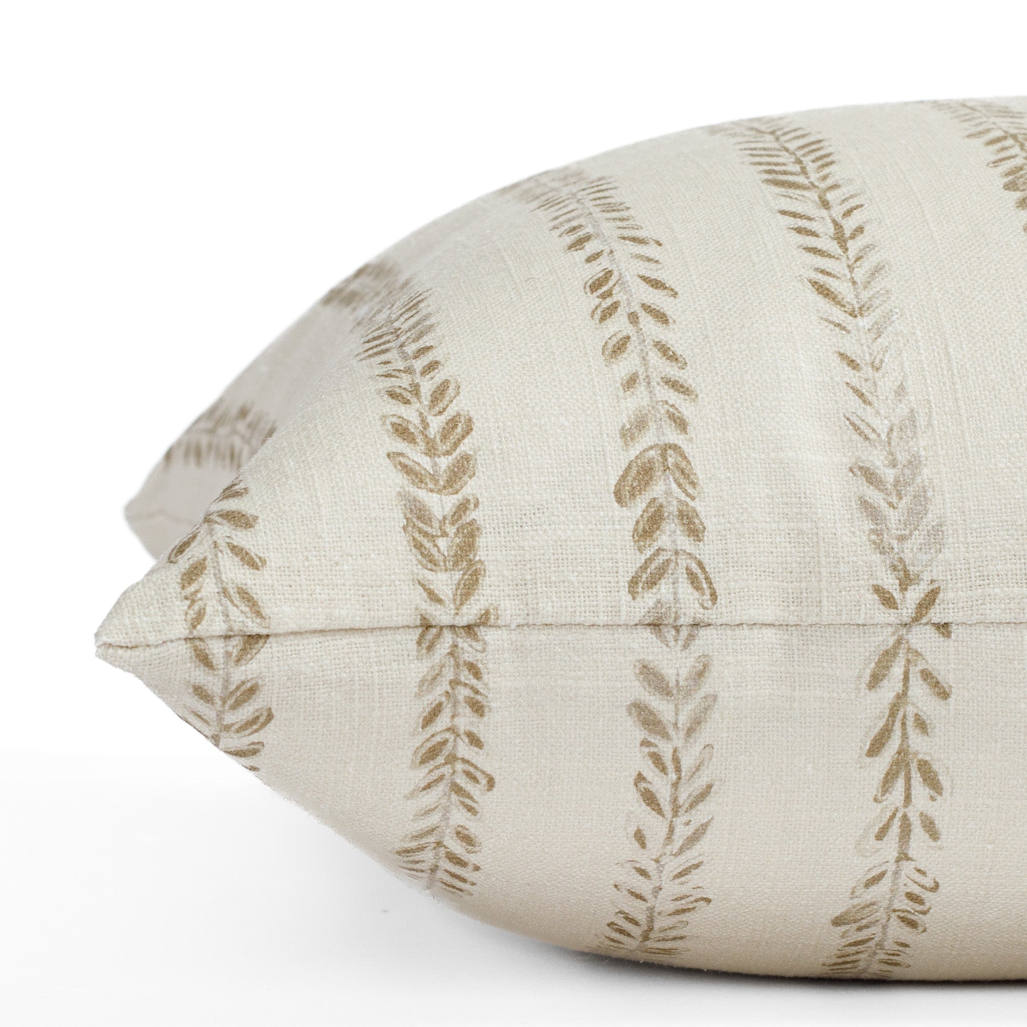 a chestnut brown and cream leaf vine block print pillow : close up side view
