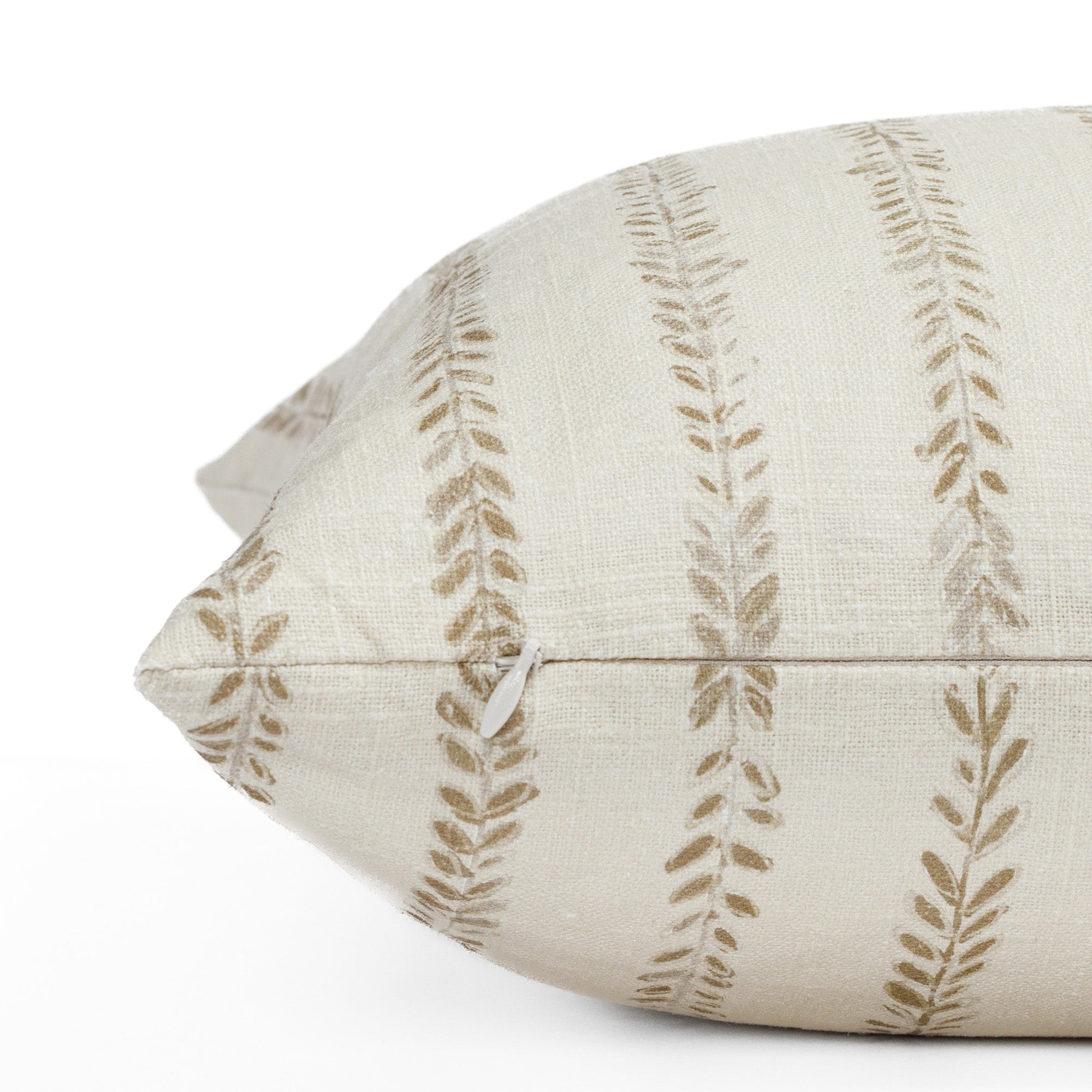 a chestnut brown and cream leaf vine block print pillow : close up zipper view