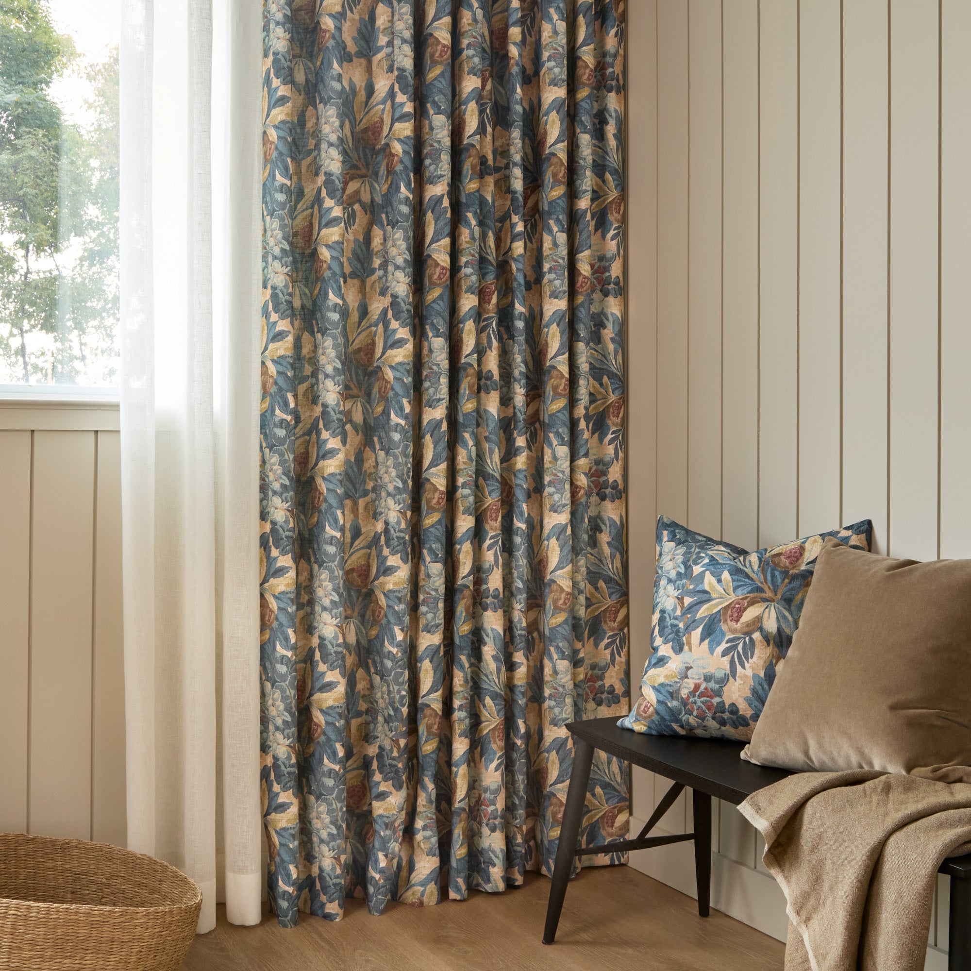 Juno Fabric, Navy by Tonic Living — shown as drapery behind a bench styled with the Juno 20x20 Pillow, Navy and Valentina Velvet Pillow, Toffee.