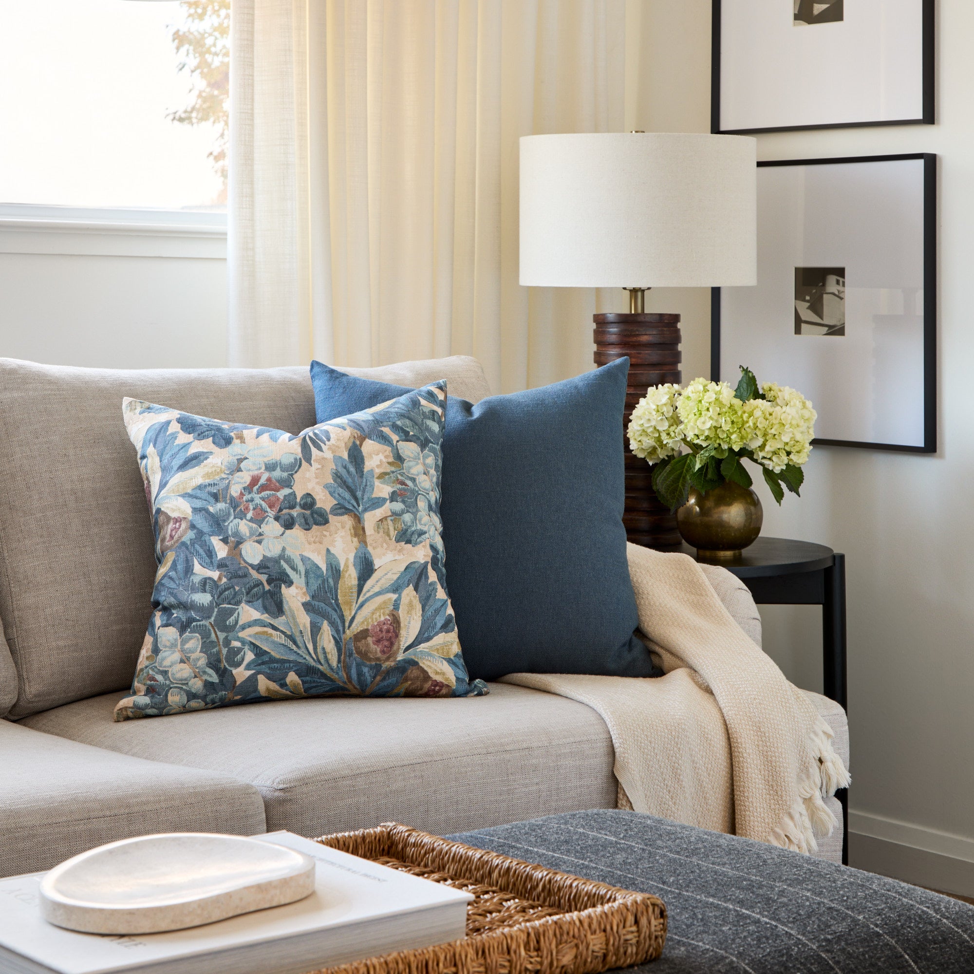 A mix of Tonic Living blue toned toss cushions styled on a sofa.