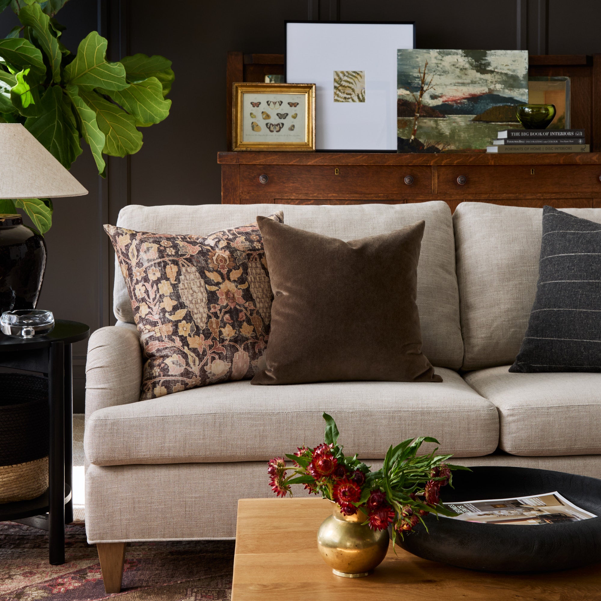 Living room with Kalida Walnut botanical print and Valentina Velvet dark brown pillows styled on a sofa – Tonic Living