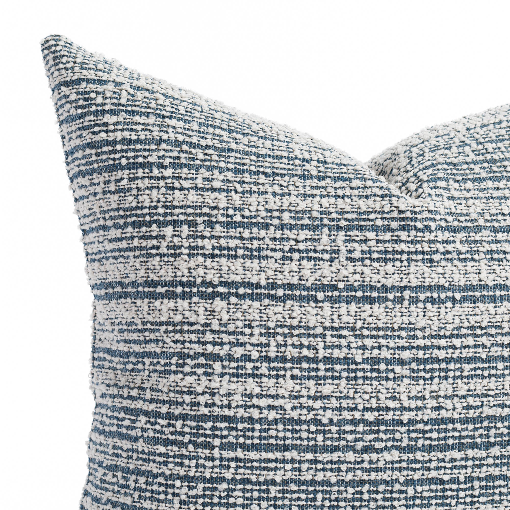 a blue and white loopy striped pillow : Close up view