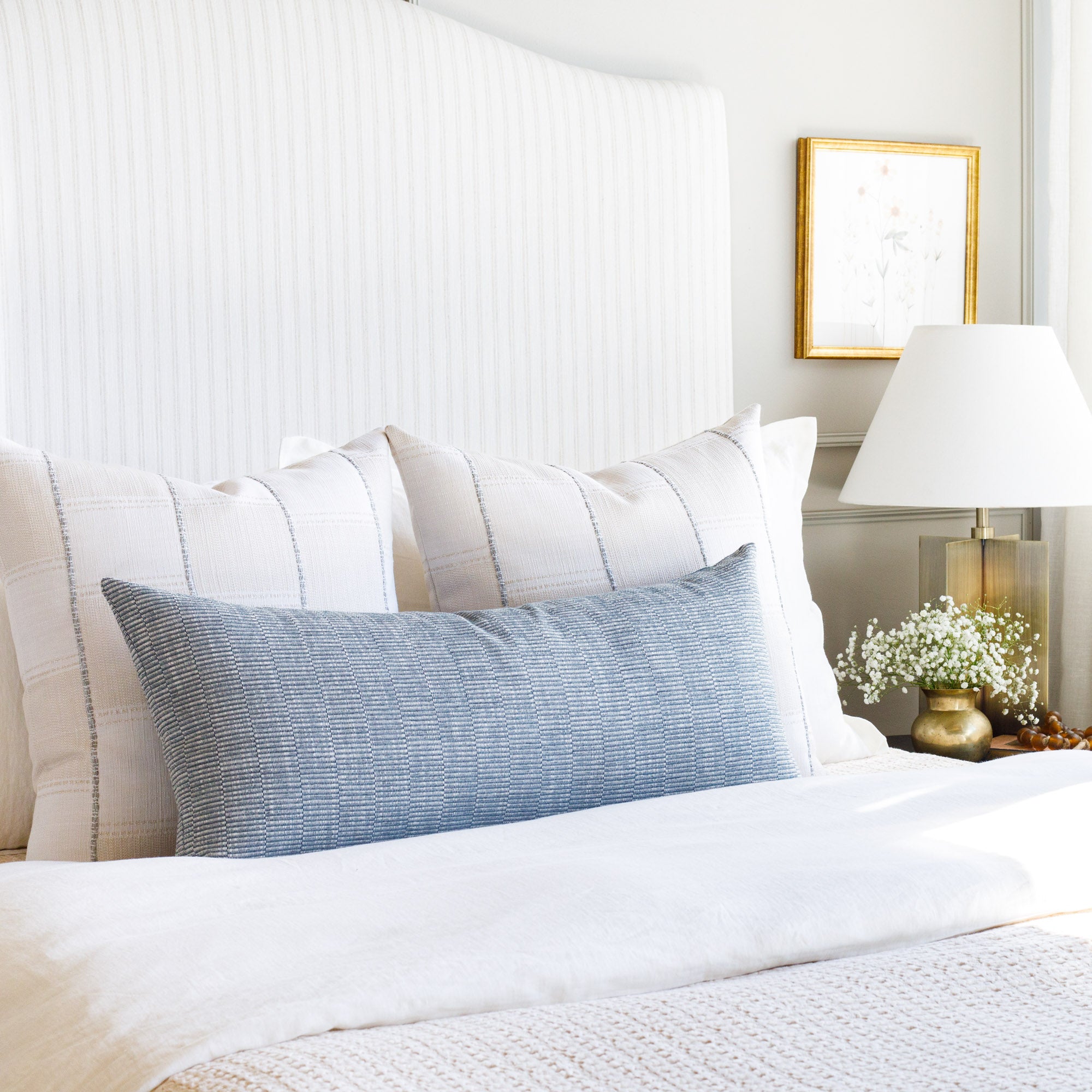 Serene cream & blue bedroom with Tonic Living throw pillows