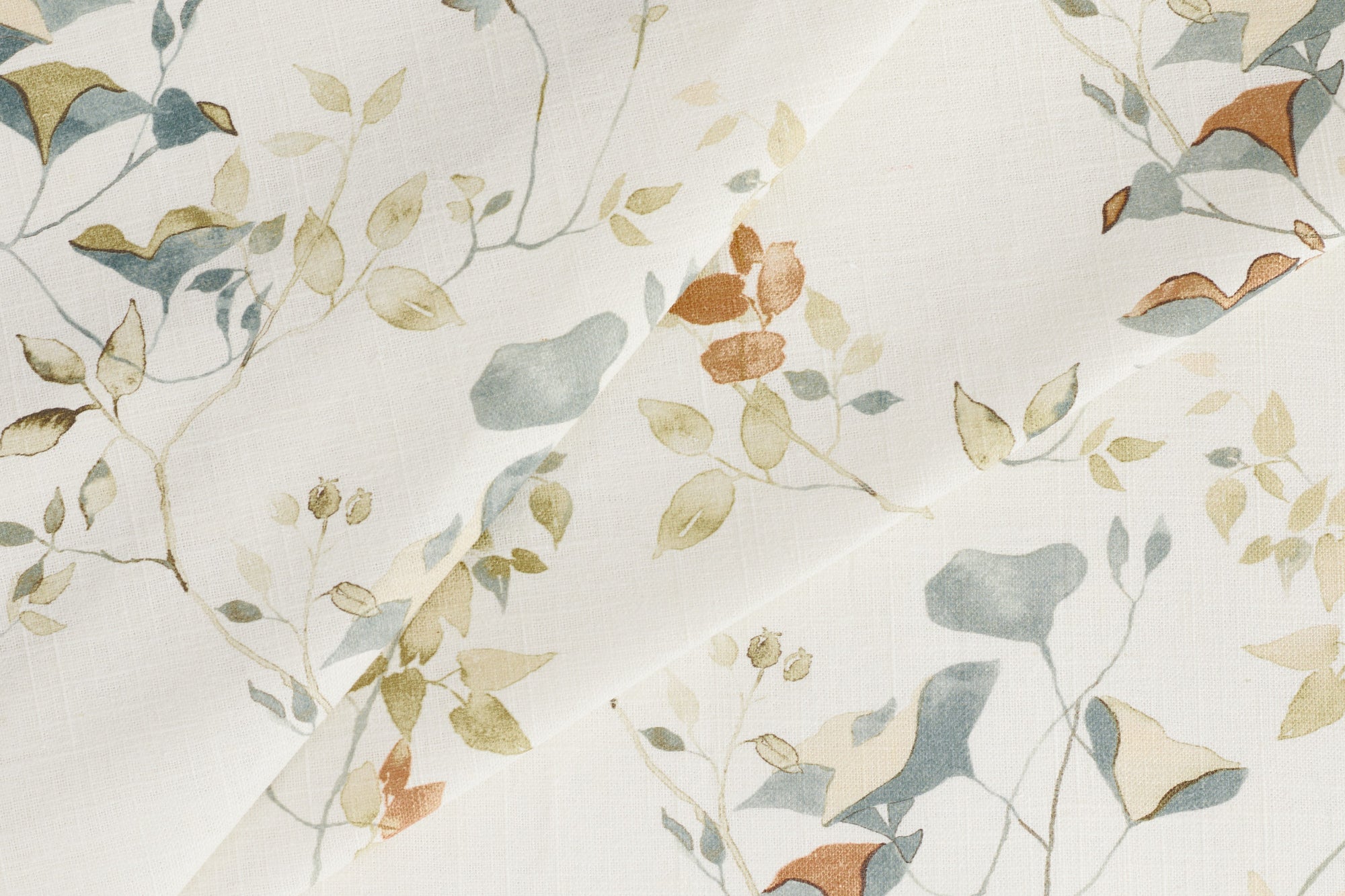 Tonic Living Laurel Meadow home decor fabric with a delicate botanical pattern in earthy blue and terracotta tones.