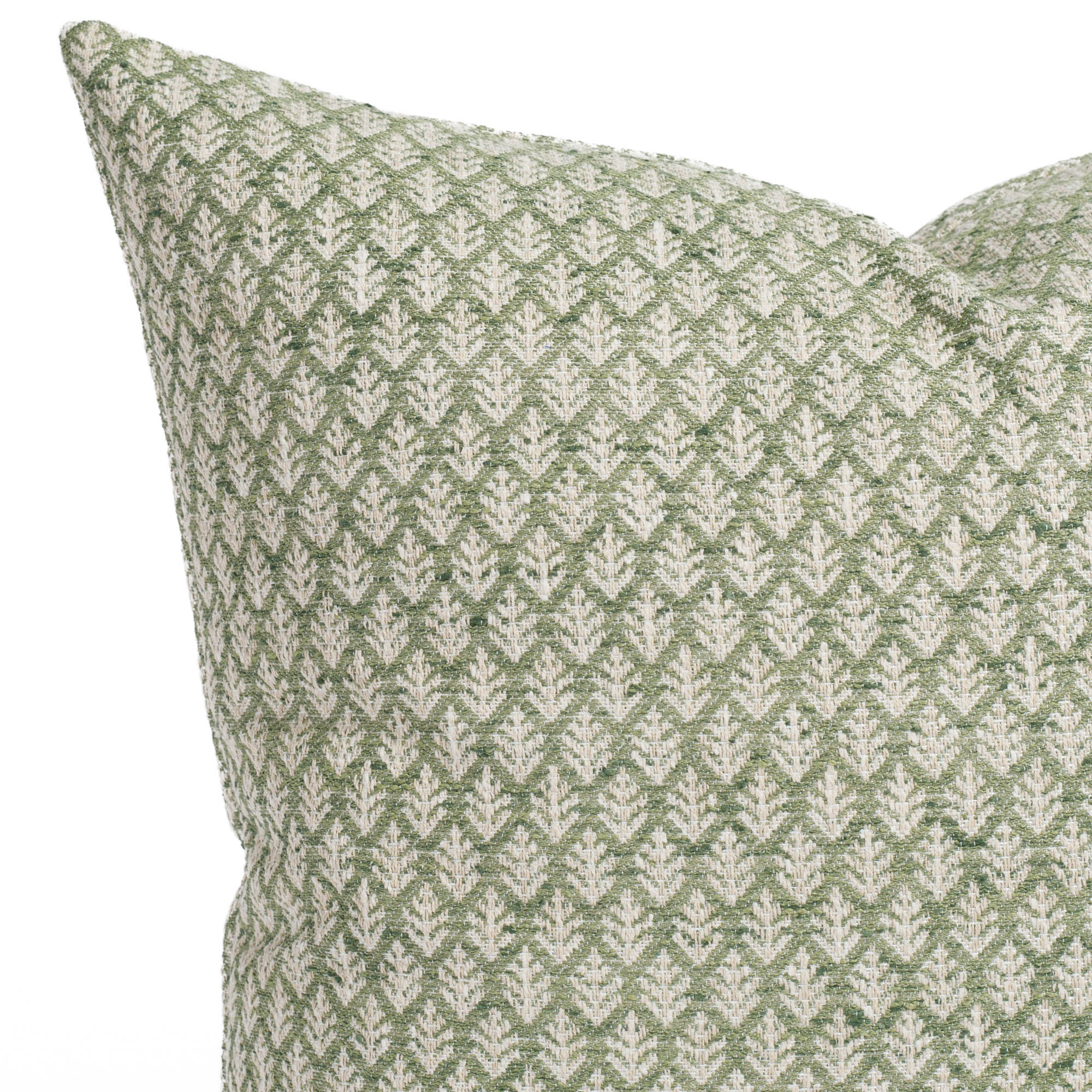 A meadow green and tan leaf-patterned pillow: close up view.