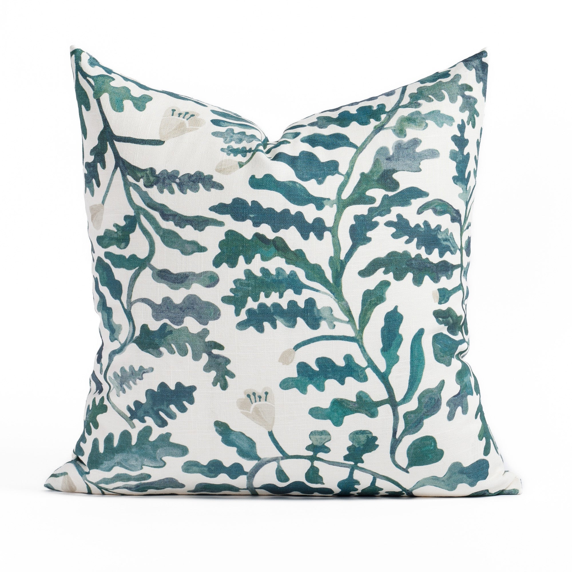 a green and white leafy botanical throw pillow