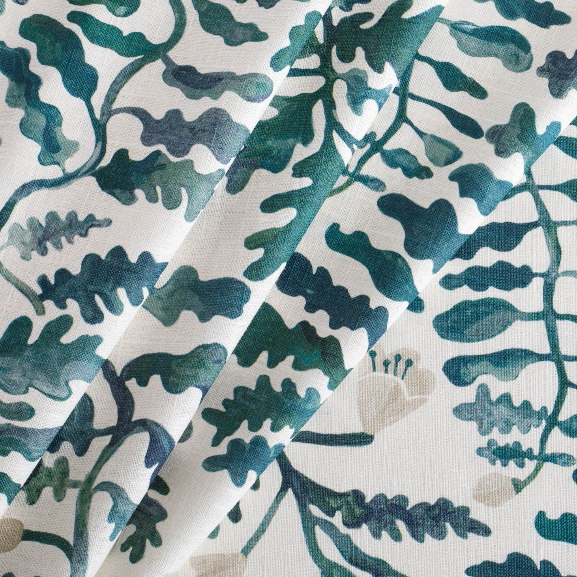 a green and white leafy botanical print fabric 