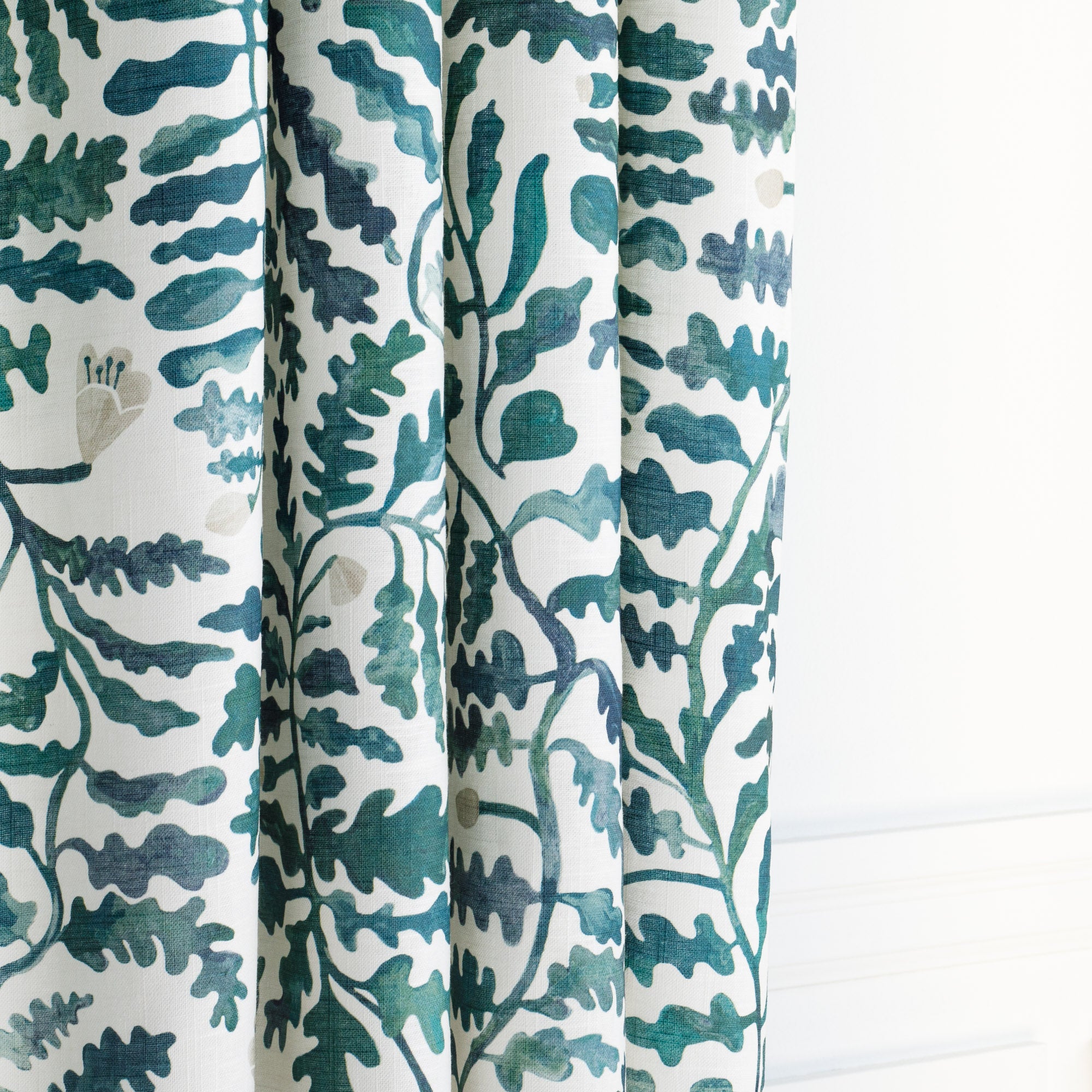 a teal and forest green and white leafy botanical linen blend fabric