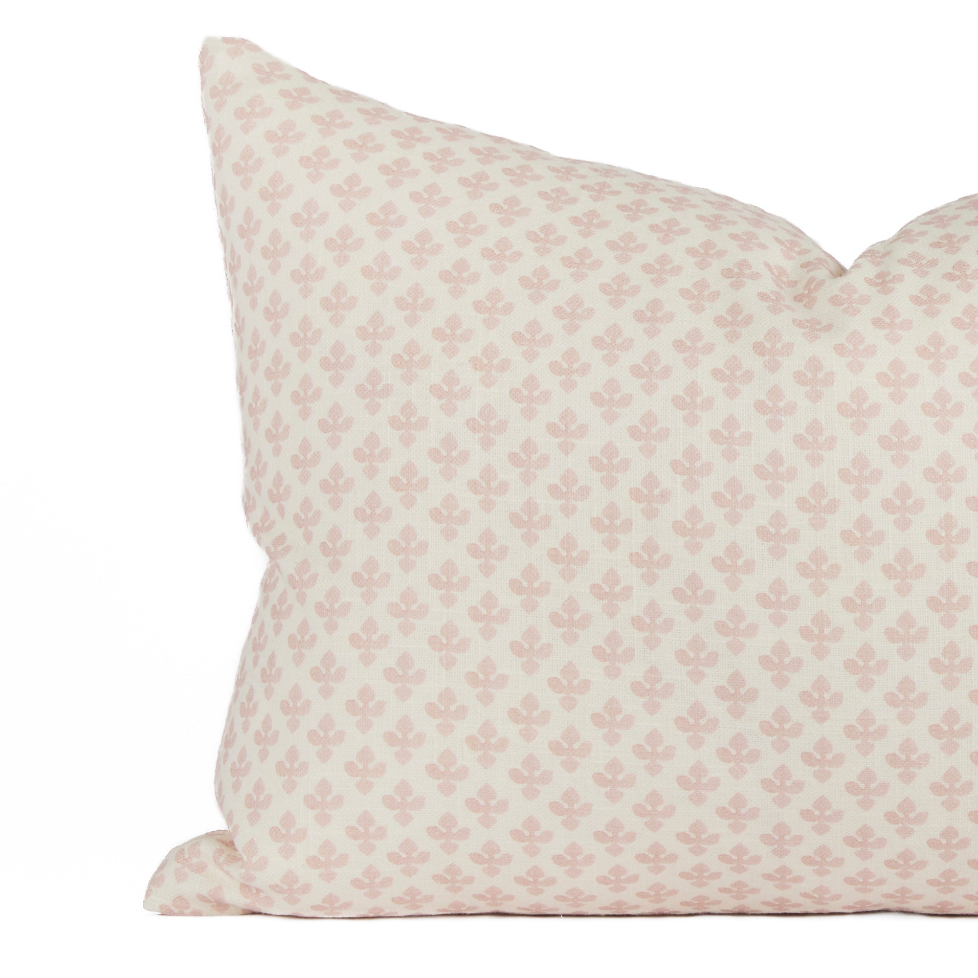 Close-up of Lyra Blush lumbar pillow by Tonic Living — delicate soft white and baby pink floral block print design.