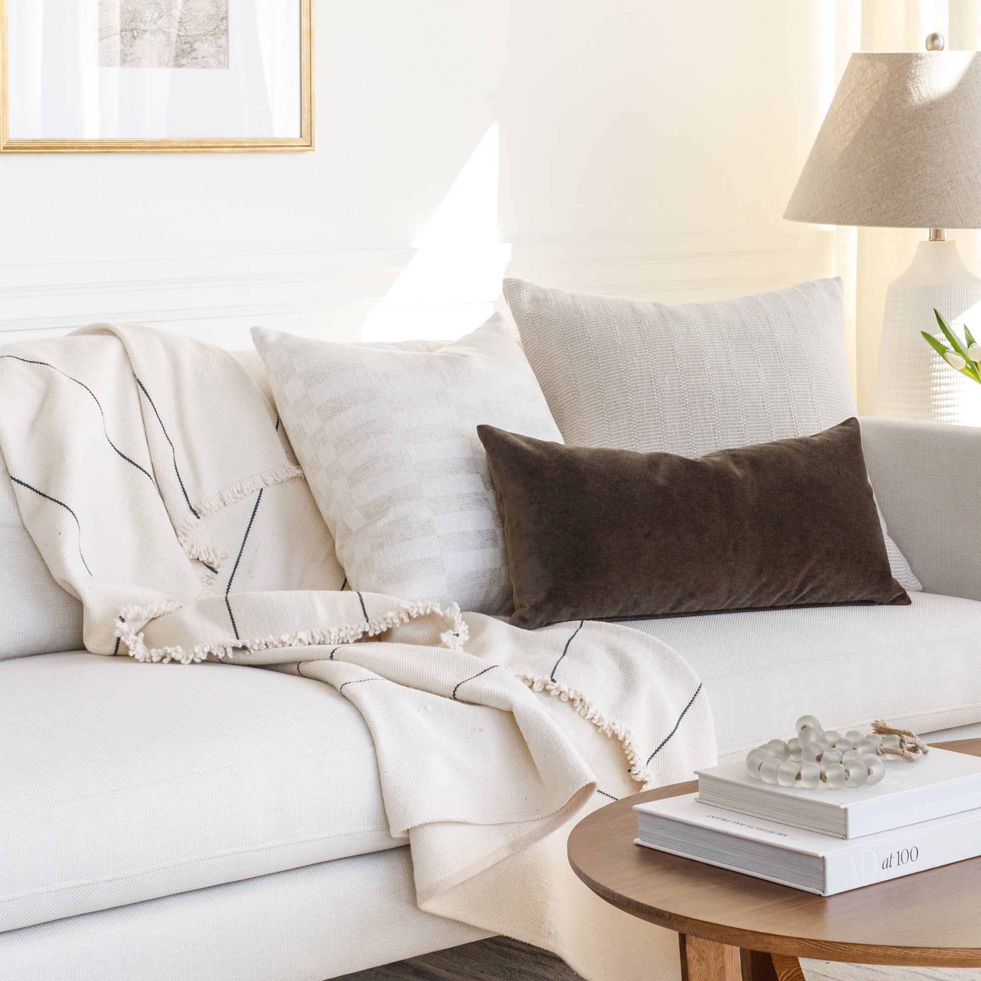 Sofa vignette: Tonic Living neutral home decor and throw blanket