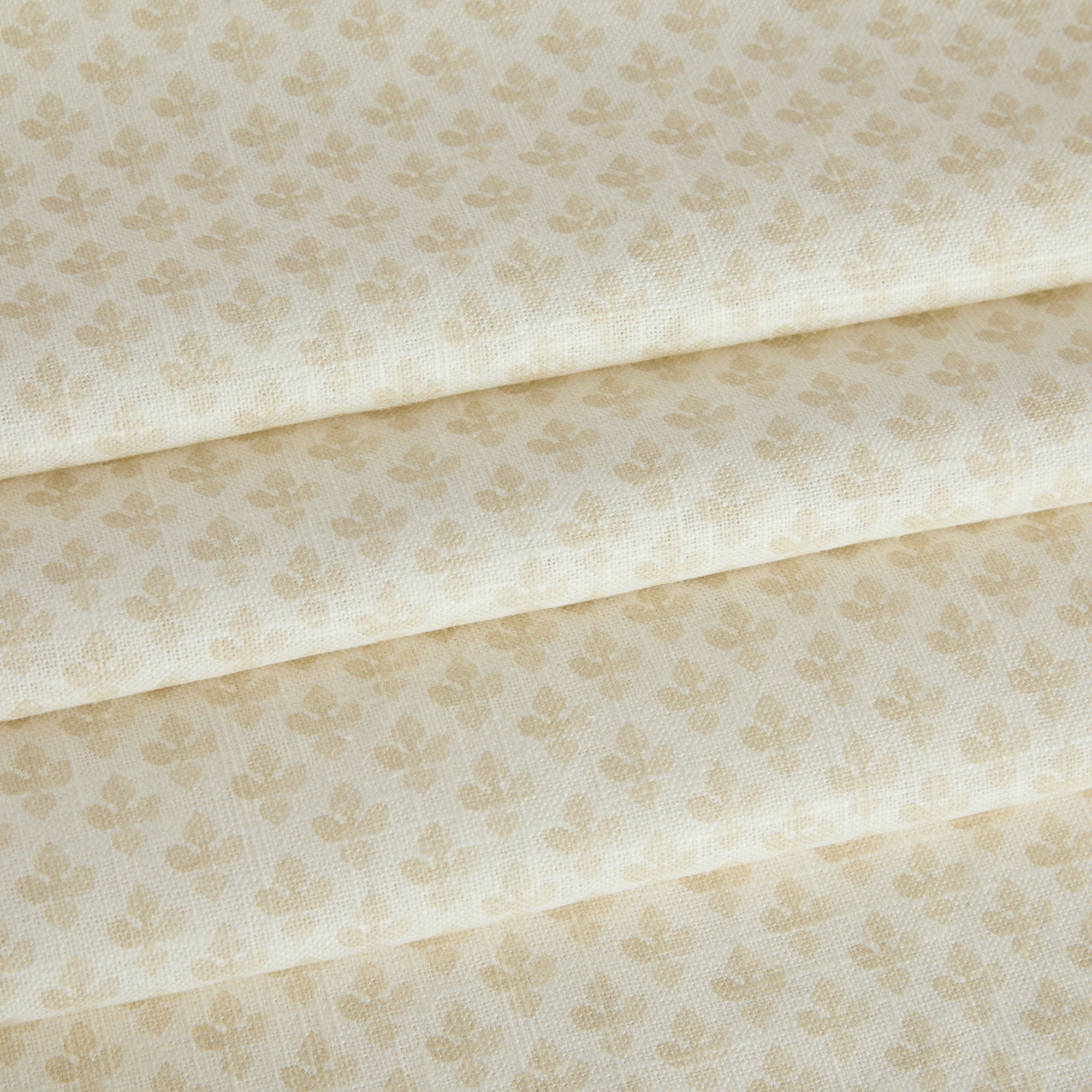 Lyra Parchment roman shade fabric by Tonic Living — lightweight linen-blend fabric with a neutral warm white and beige floral block print.