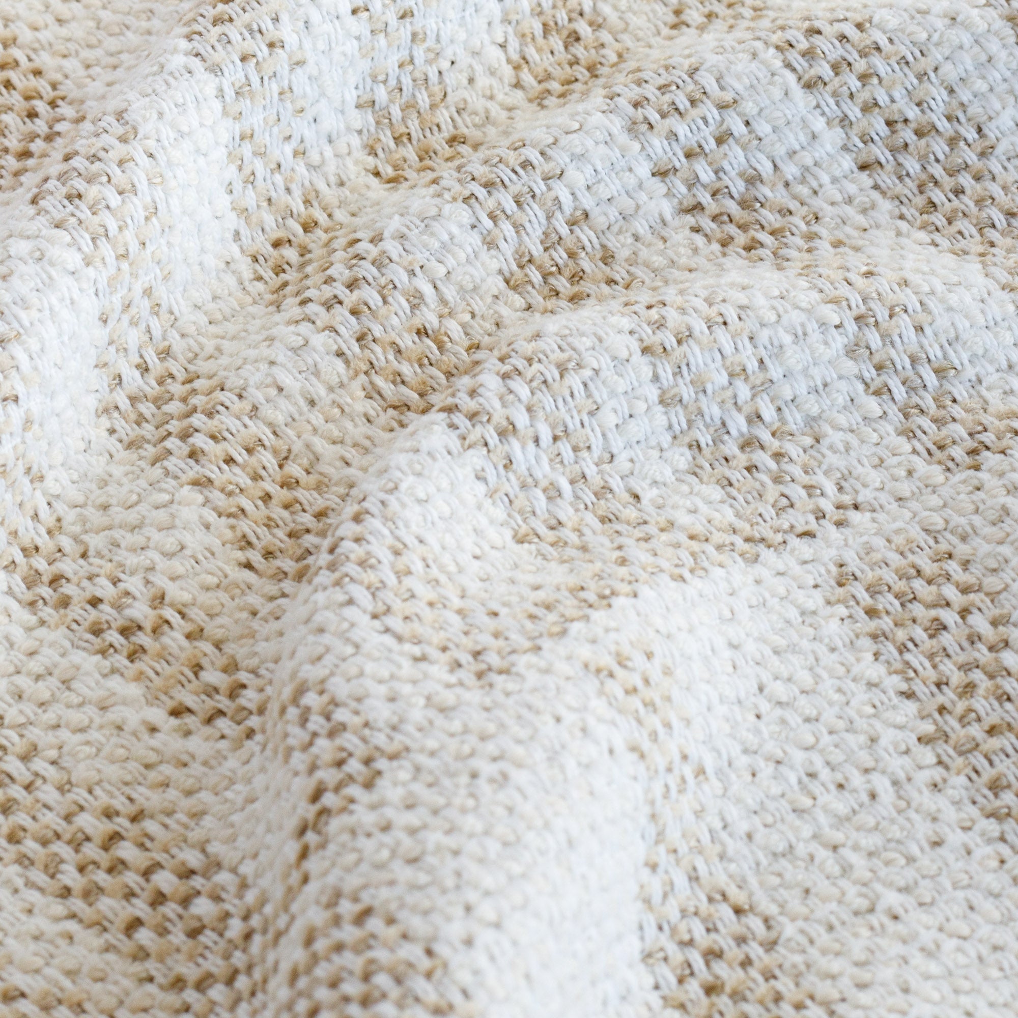 a beige and white outdoor upholstery fabric : close up view