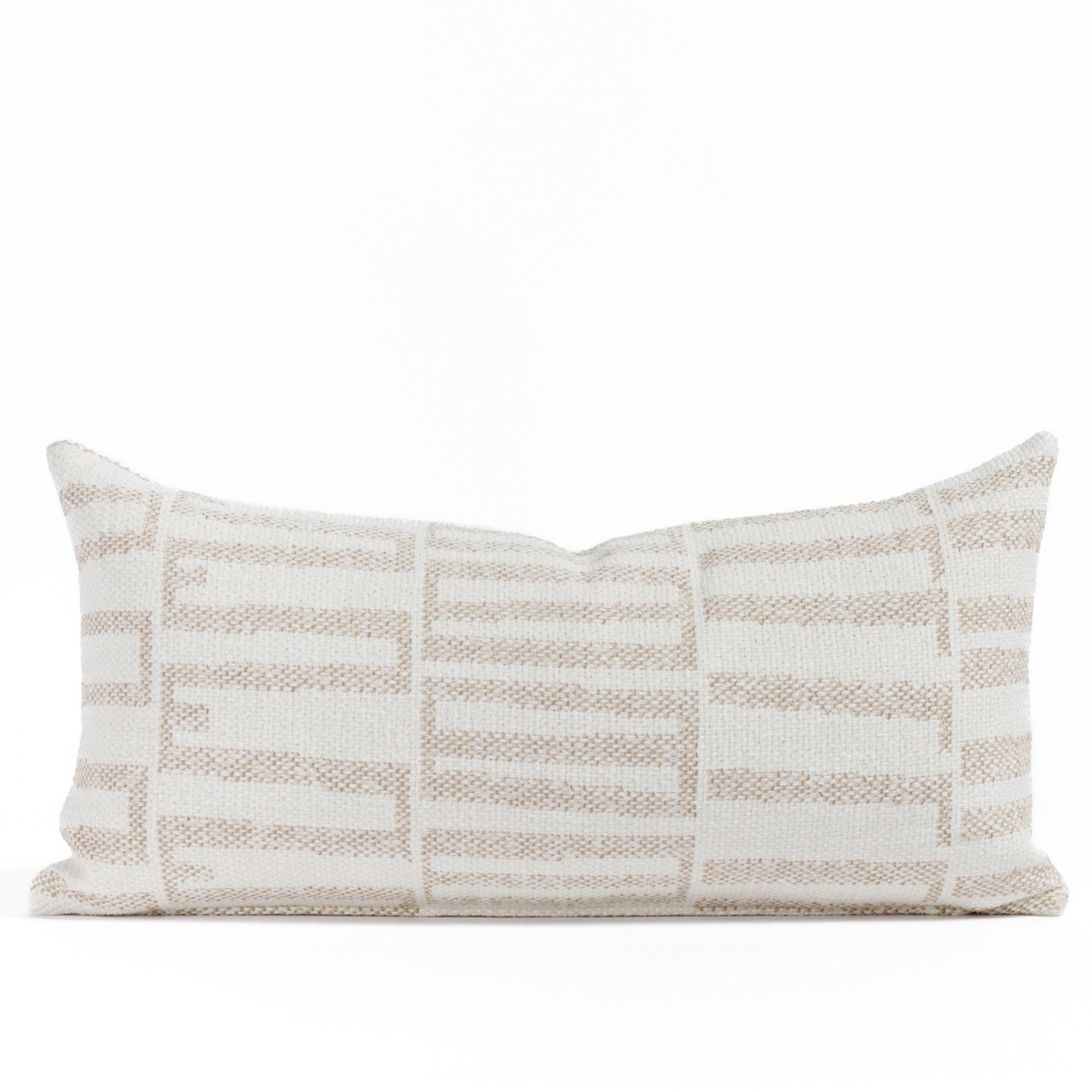 Front view of Tonic Living’s Mallia 12x24 outdoor lumbar pillow in Toasted Coconut, featuring a nutty beige and off-white geometric design on durable, high-performance fabric.