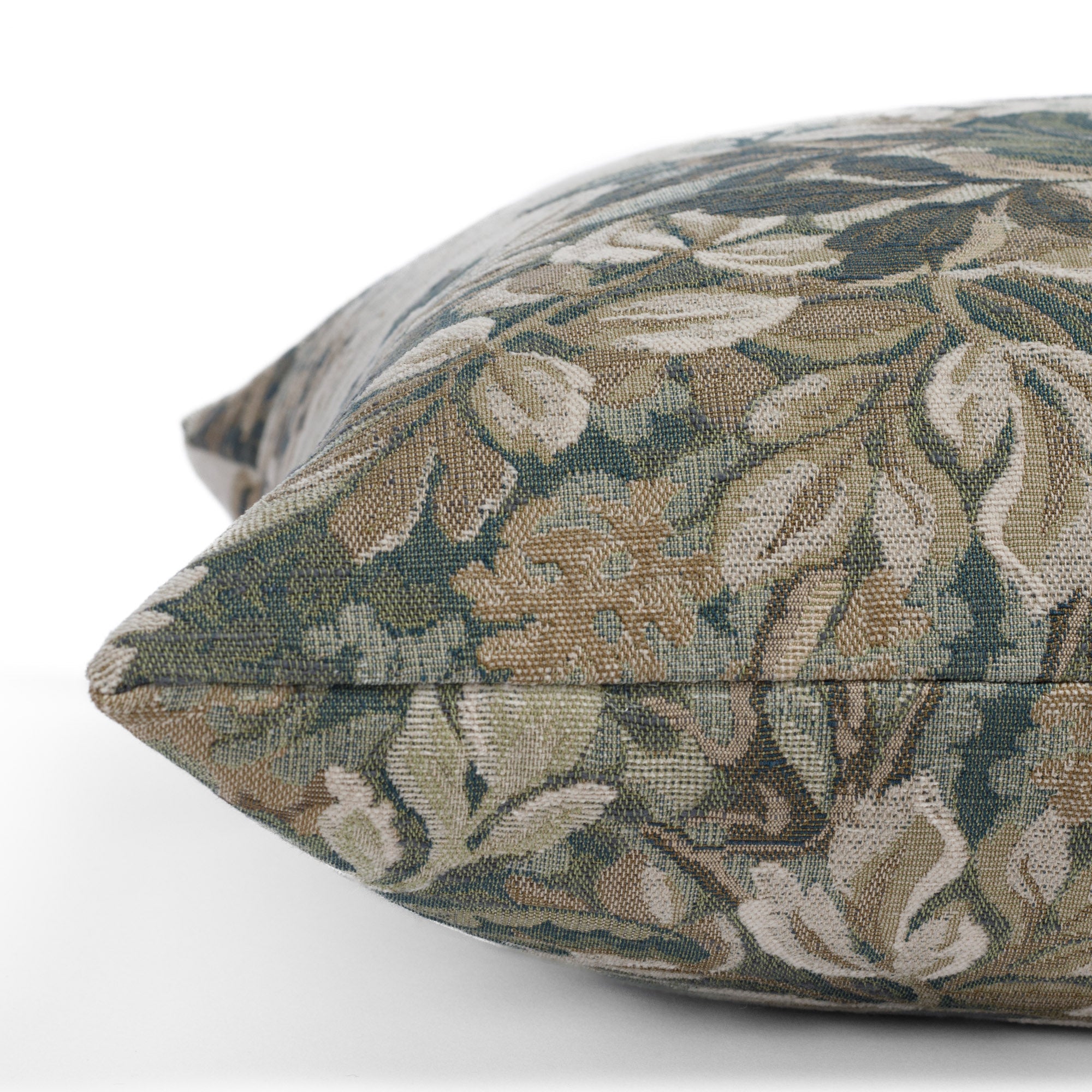 Side angle of Manor Tapestry Sage decorative cushion in muted green with French-style woven botanical design.