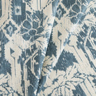 a cream and blue botanical ikat print home decor fabric