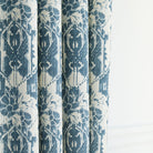 a cream and blue botanical ikat print drapery fabric
