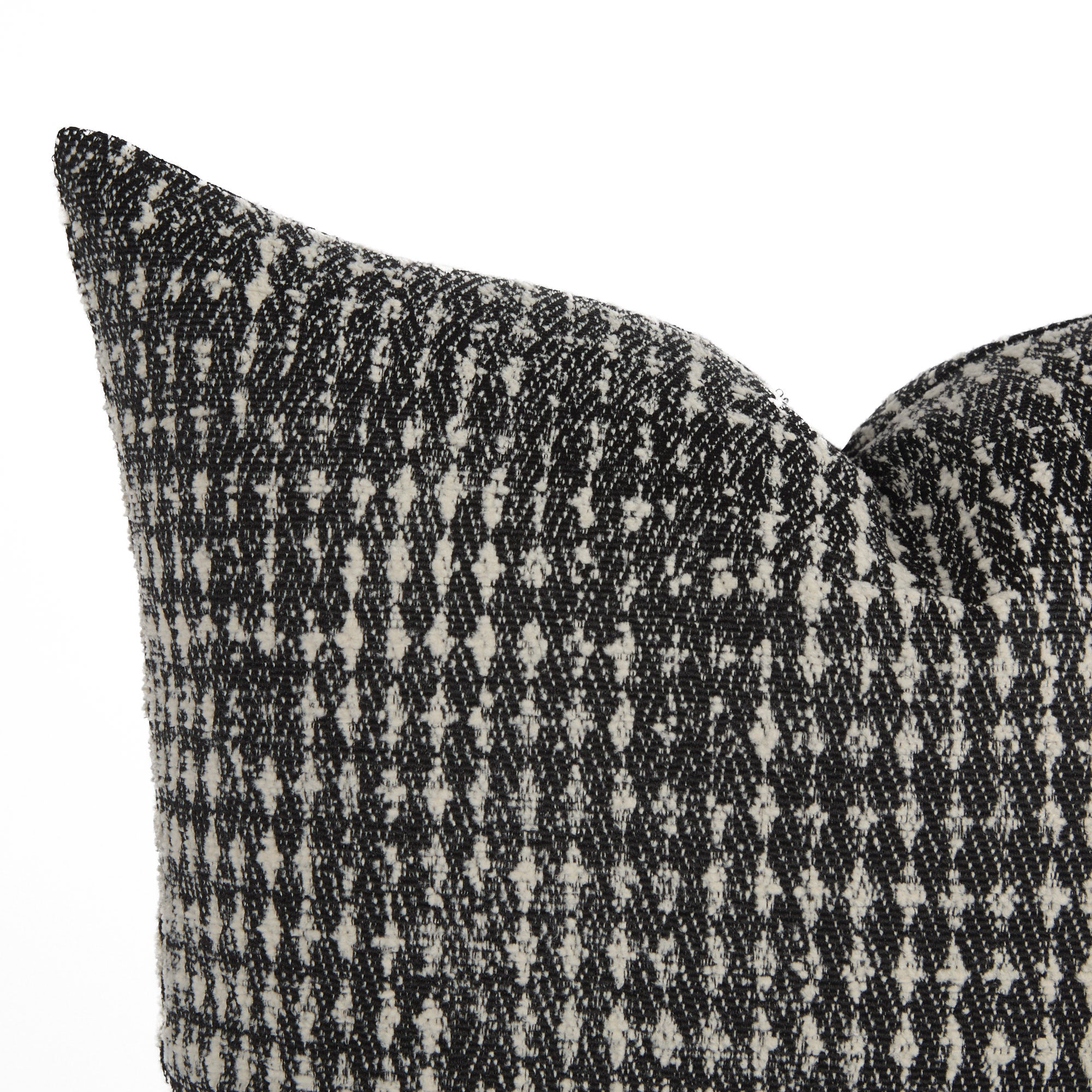 Close-up of Otto Domino Pillow by Tonic Living – textured black and white cushion with bold pattern.