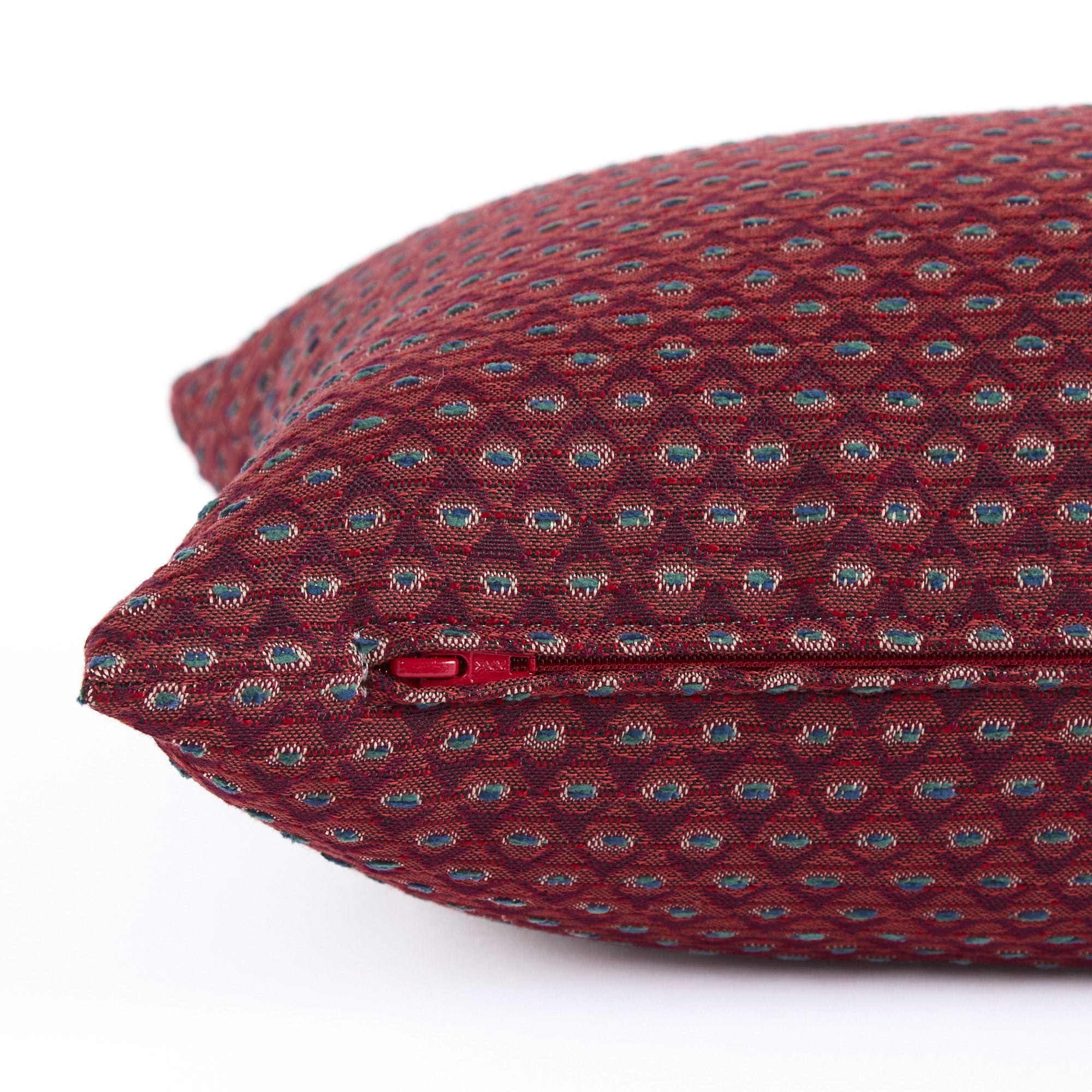 Side zipper detail of Pembrook 14x20 lumbar pillow in burgundy diamond weave fabric, Tonic Living.