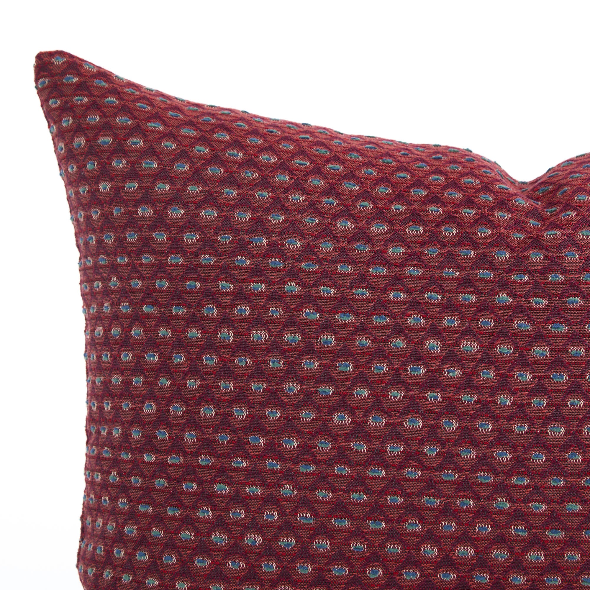 Close up of Pembrook 14x20 lumbar pillow, burgundy red with intricate diamond design, Tonic Living.