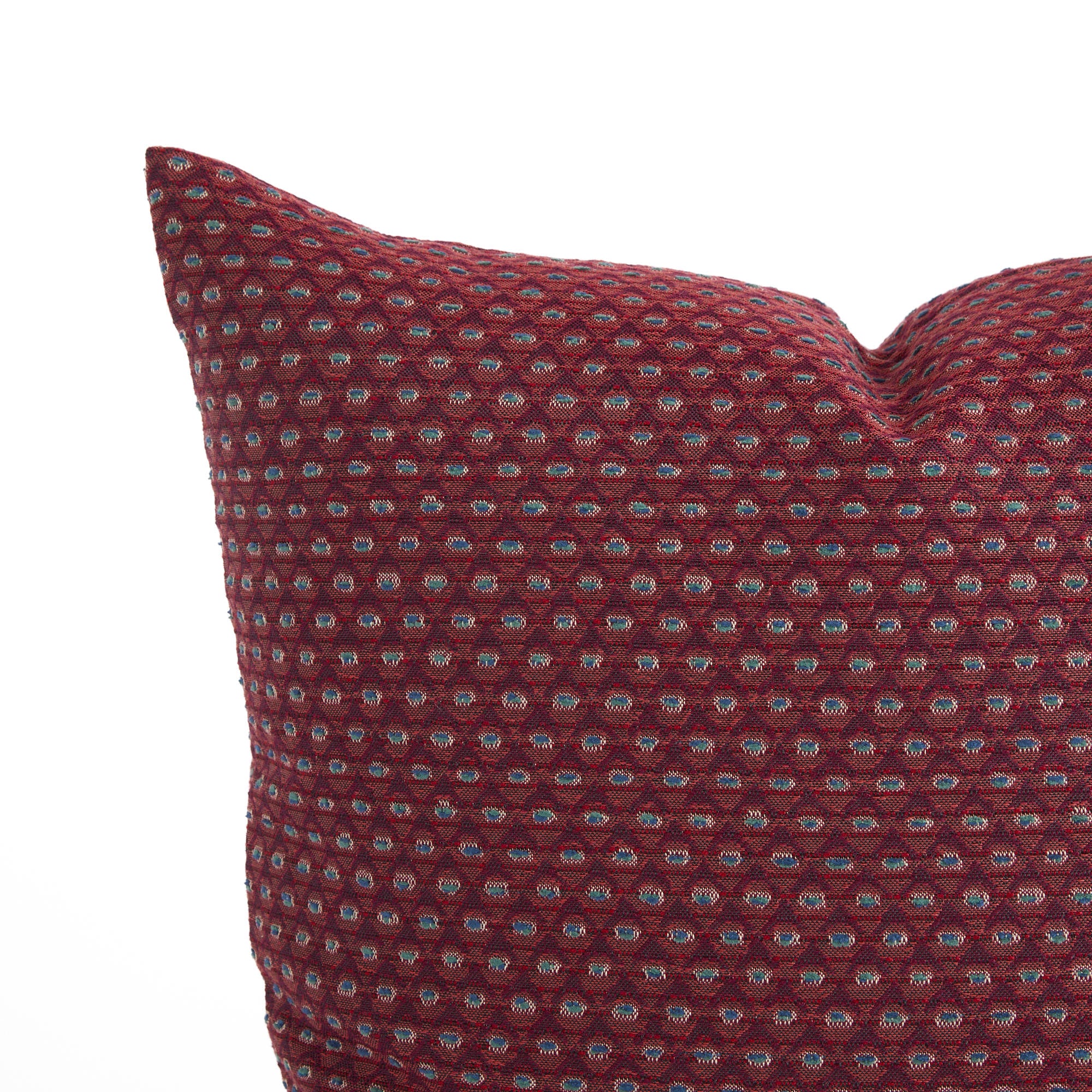 Close up of Pembrook 20x20 toss pillow, burgundy red diamond motif with woven detail from Tonic Living.