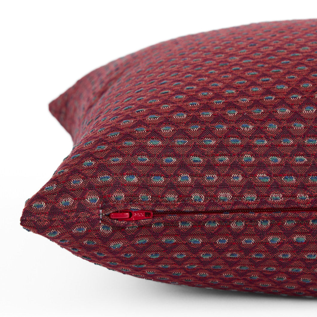 Close up of zipper on Pembrook 20x20 burgundy red indoor pillow with diamond design, Tonic Living.