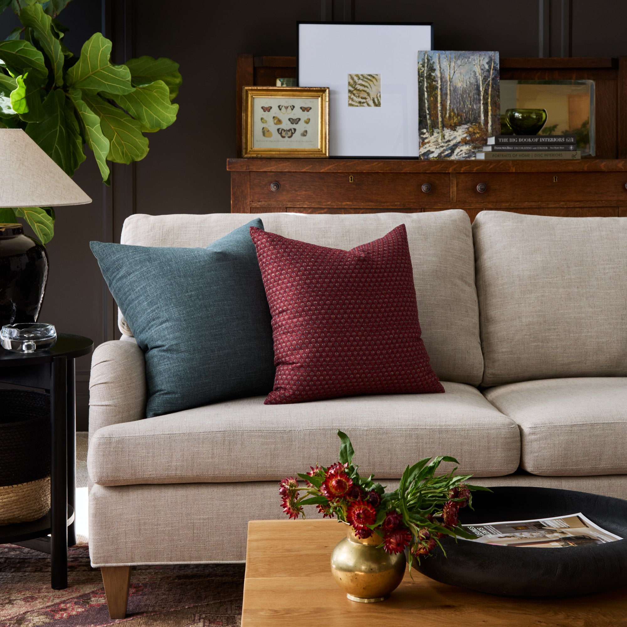 Living room with Pembrook Merlot red and Bedford Denim blue pillows styled on a sofa – Tonic Living
