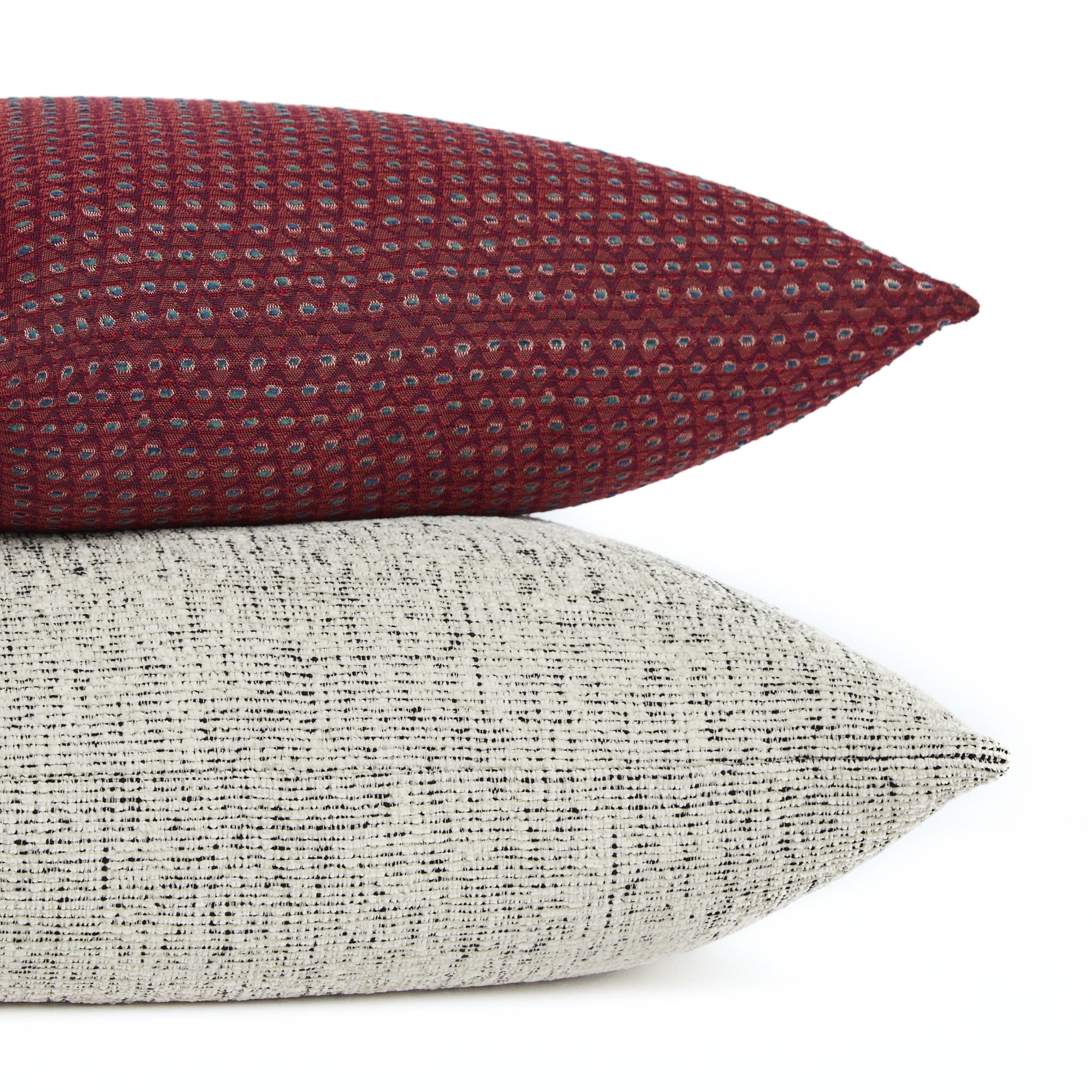 Pembrook 20x20 burgundy red pillow stacked with Atlas Salt & Pepper black and off-white cushion, Tonic Living.