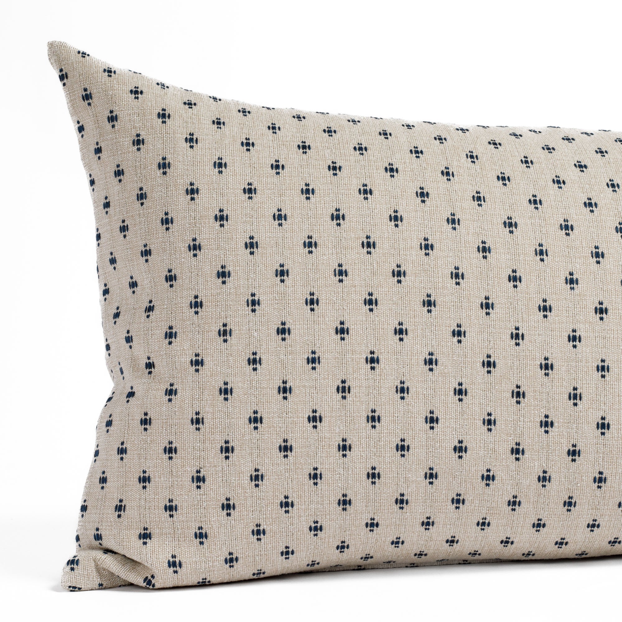 Pierce, an extra-large navy and beige lumbar pillow from Tonic Living, featuring a dot-and-dash geometric pattern: close-up view.