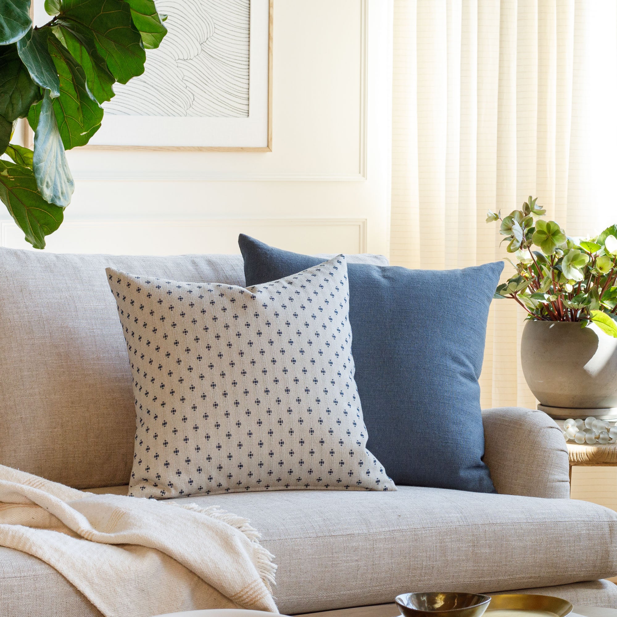 Living room with Pierce Navy blue and Oxford Indigo blue pillows styled on a sofa – Tonic Living