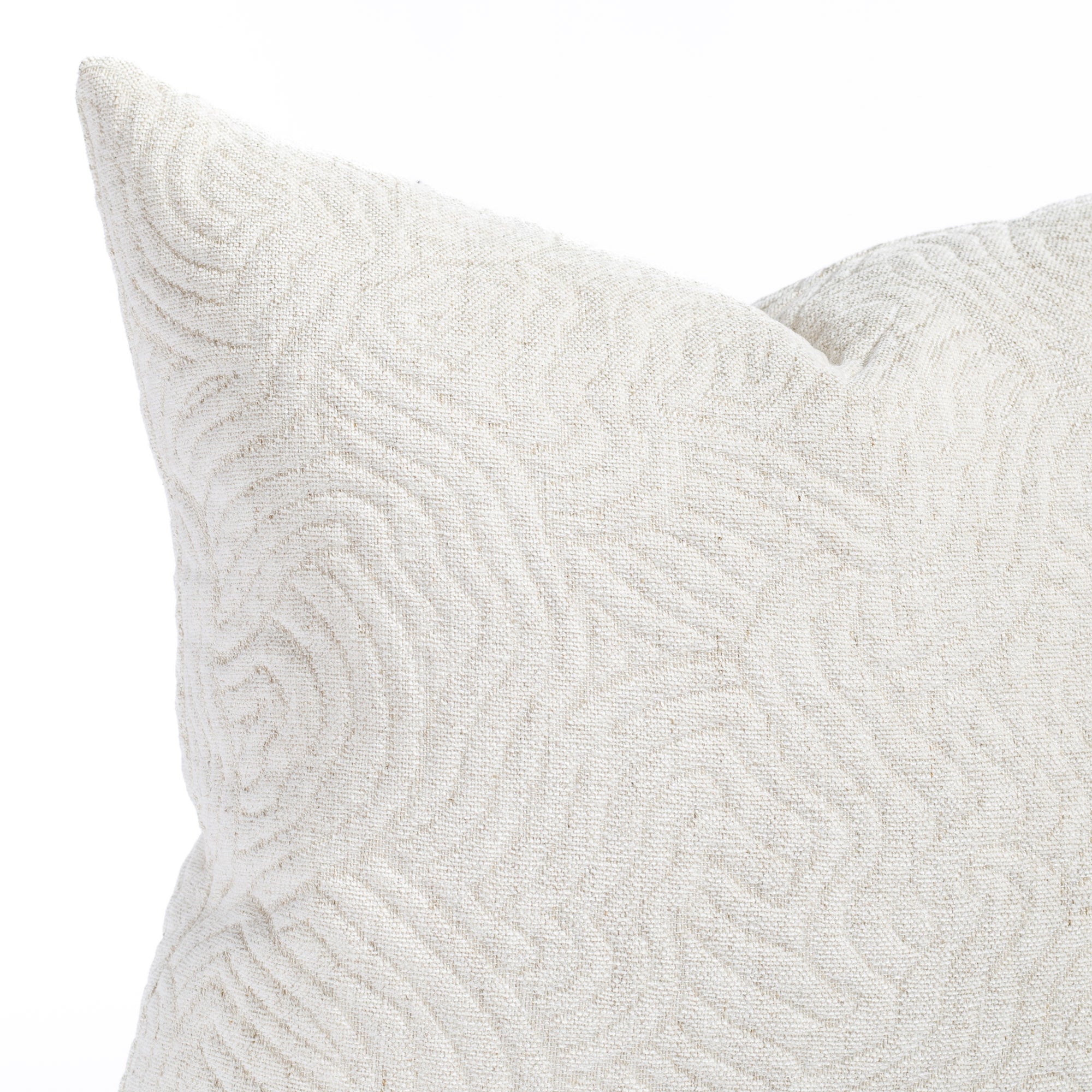 a quilted white abstract patterned pillow : close up view