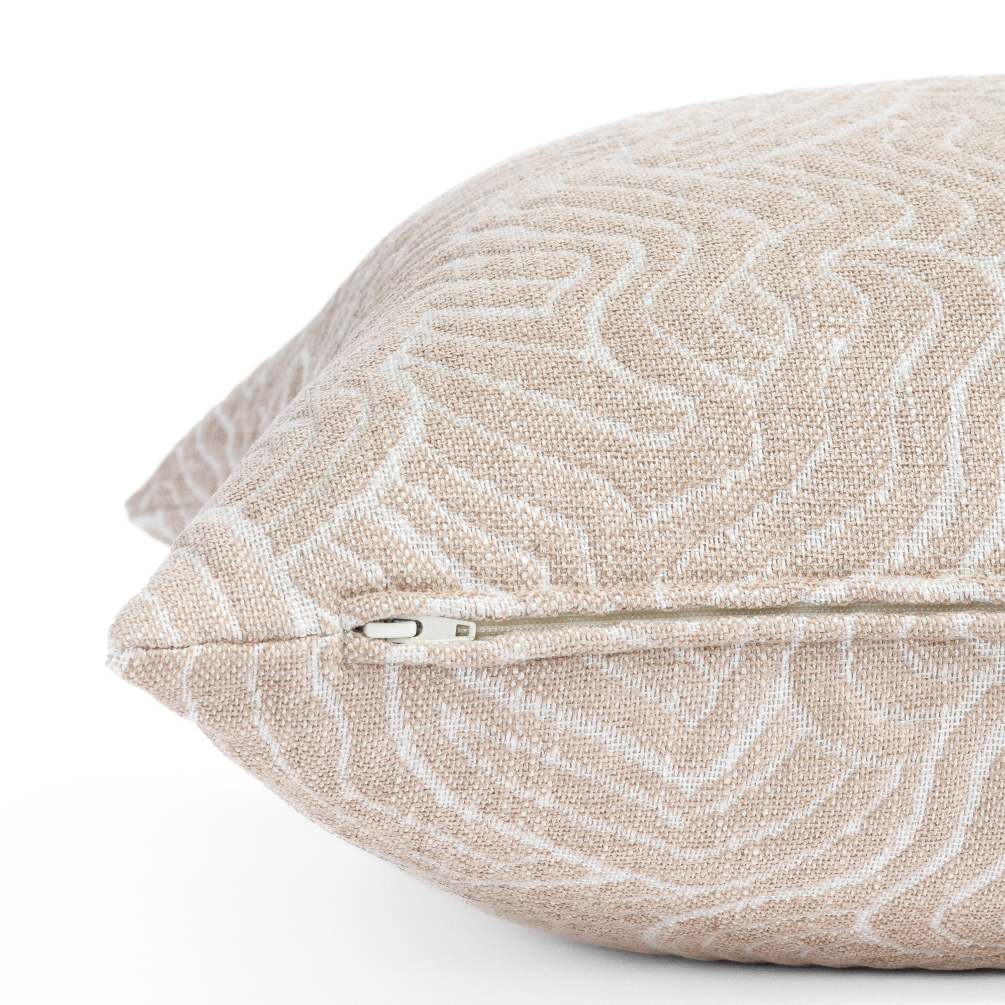 a quilted abstract rose patterned pink throw blush pillow: close up zipper view