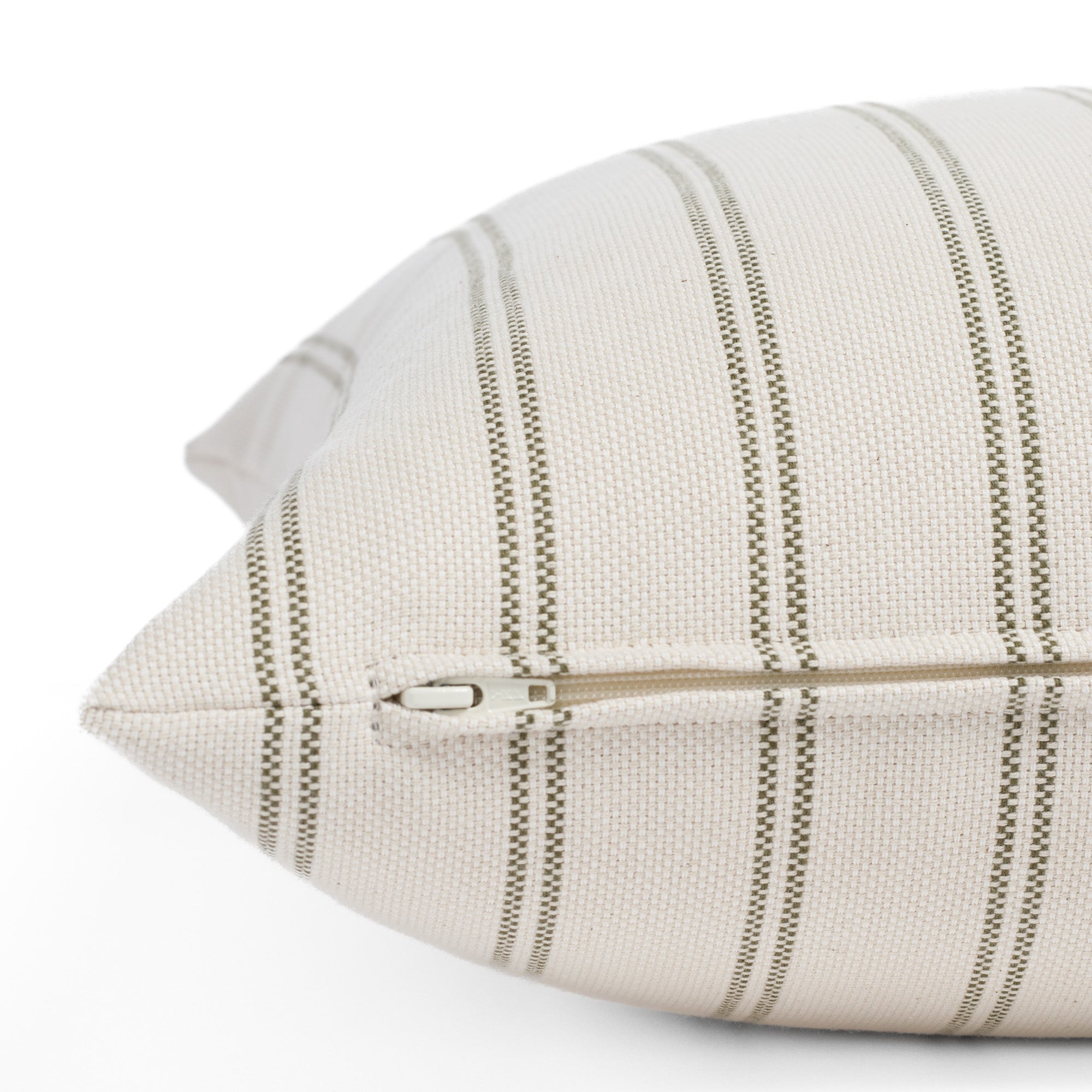 Zipper detail of Tonic Living Rexton Stripe Moss 20x20 sofa pillow in olive green and beige stripe fabric.