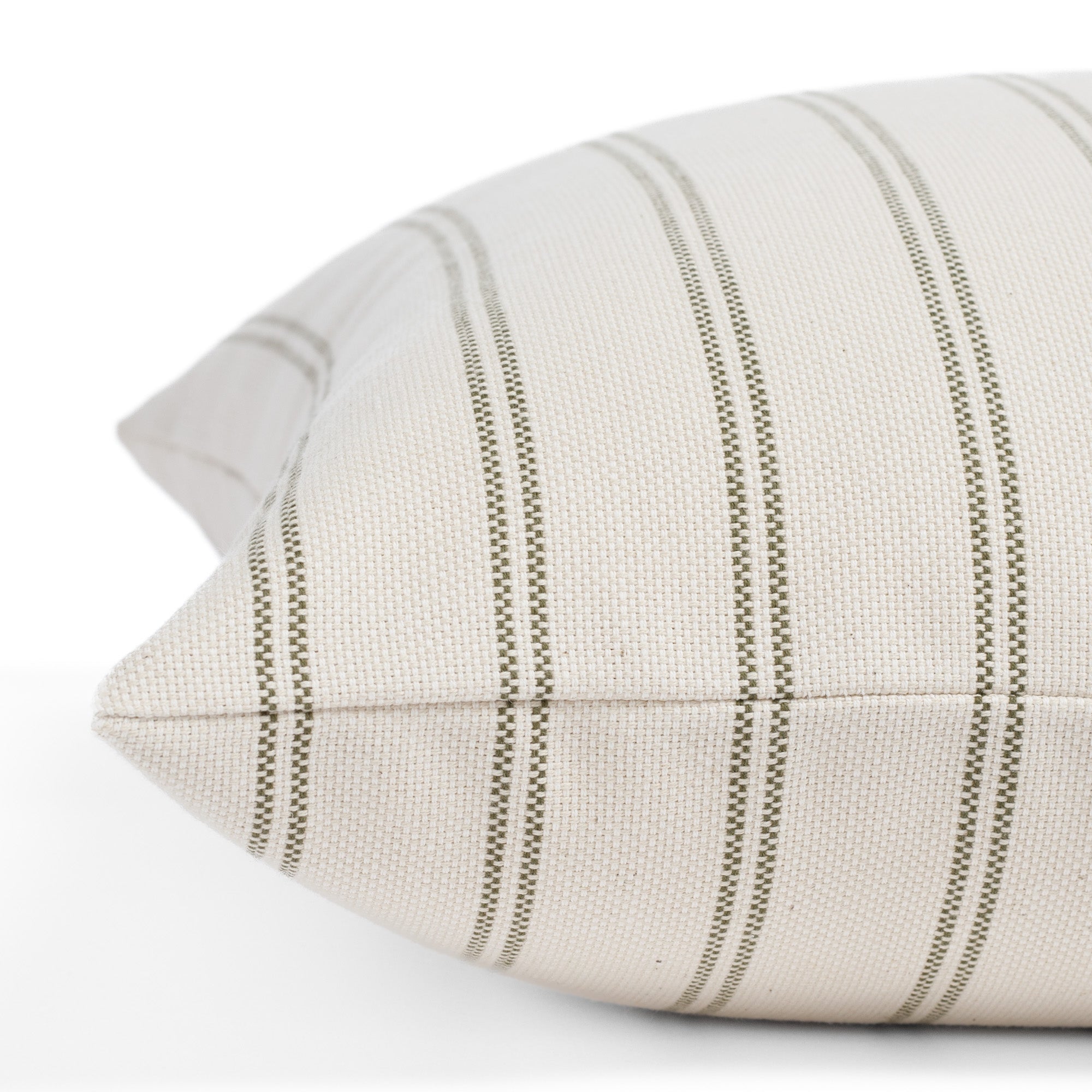 Side angle of Tonic Living Rexton Stripe Moss 20x20 toss cushion, a versatile bed pillow in green and beige ticking stripes.