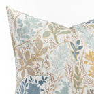 a multicolored floral garden print throw pillow : close up view