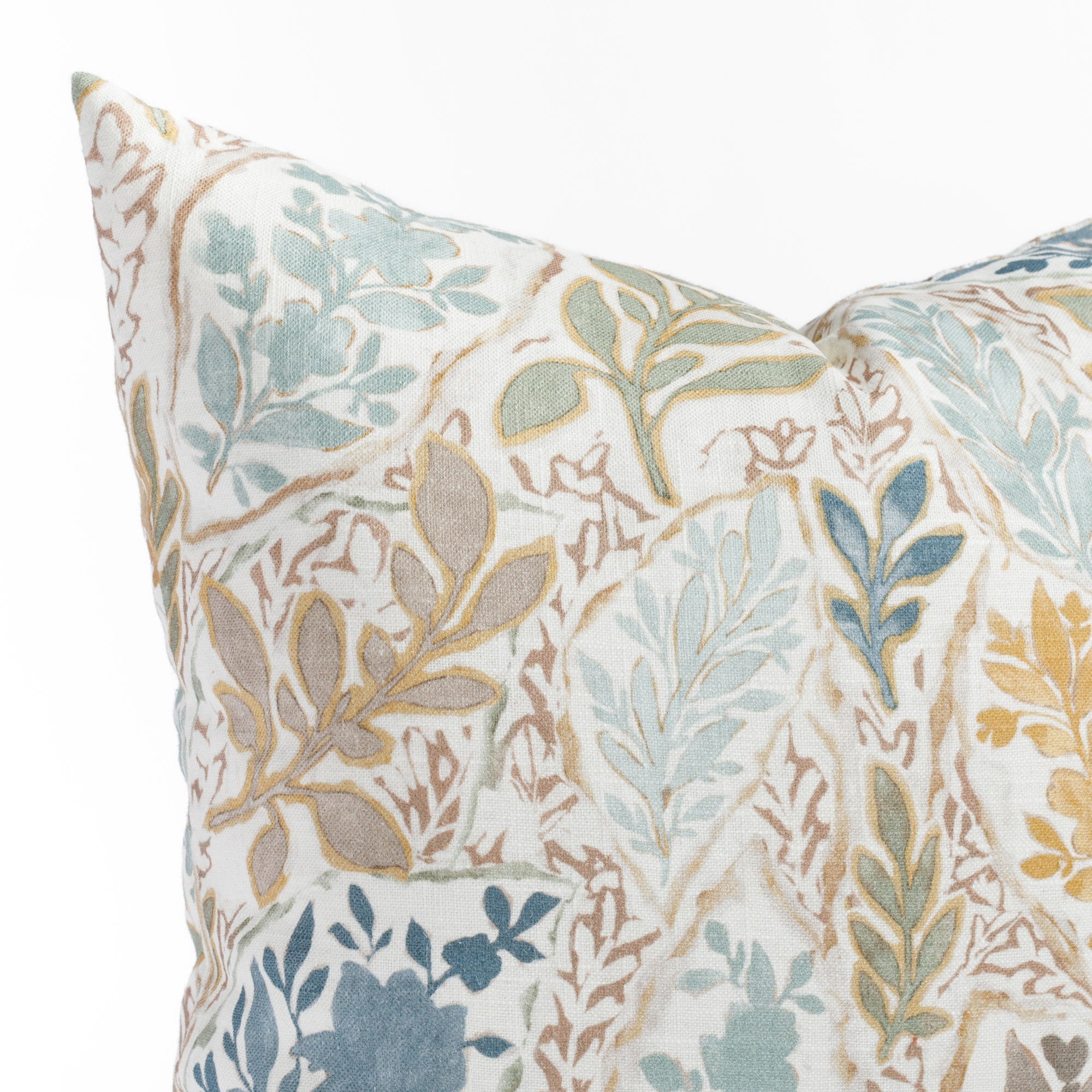 a multicolored floral garden print throw pillow : close up view