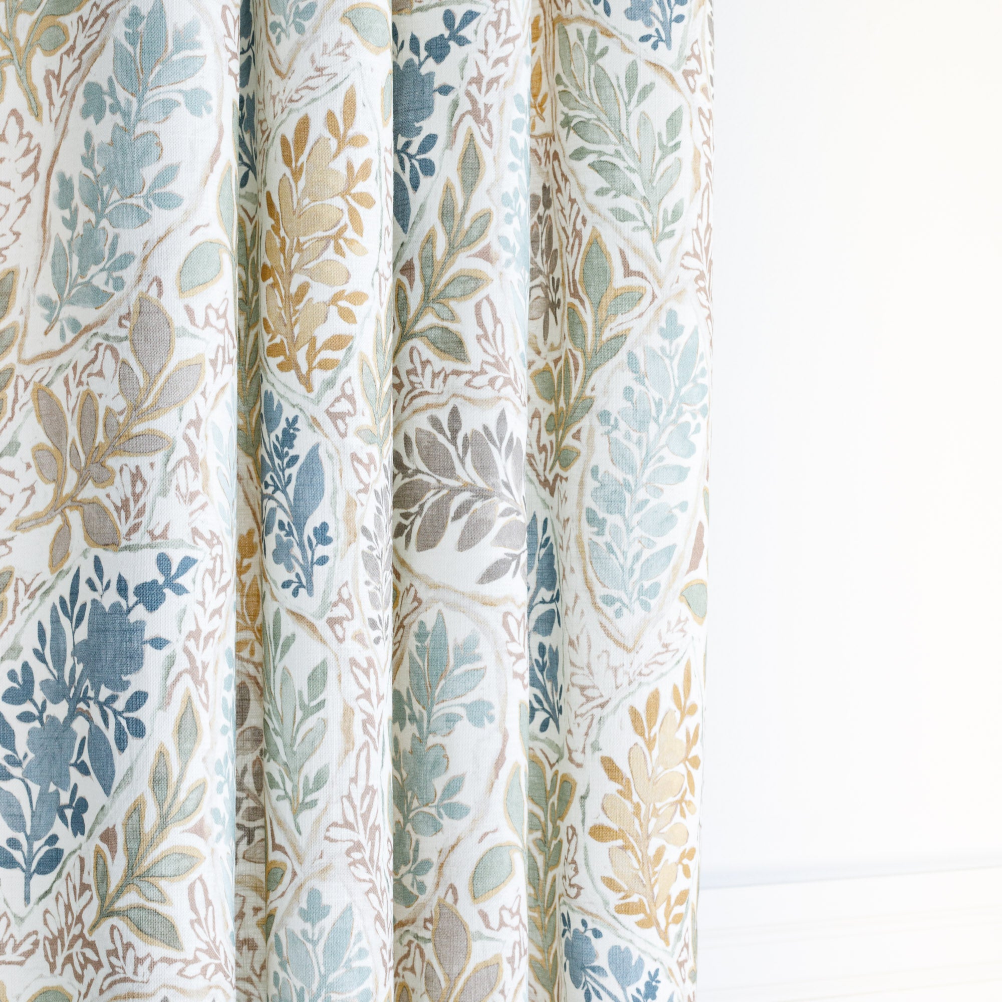 a watery multicoloured floral garden print curtain fabric