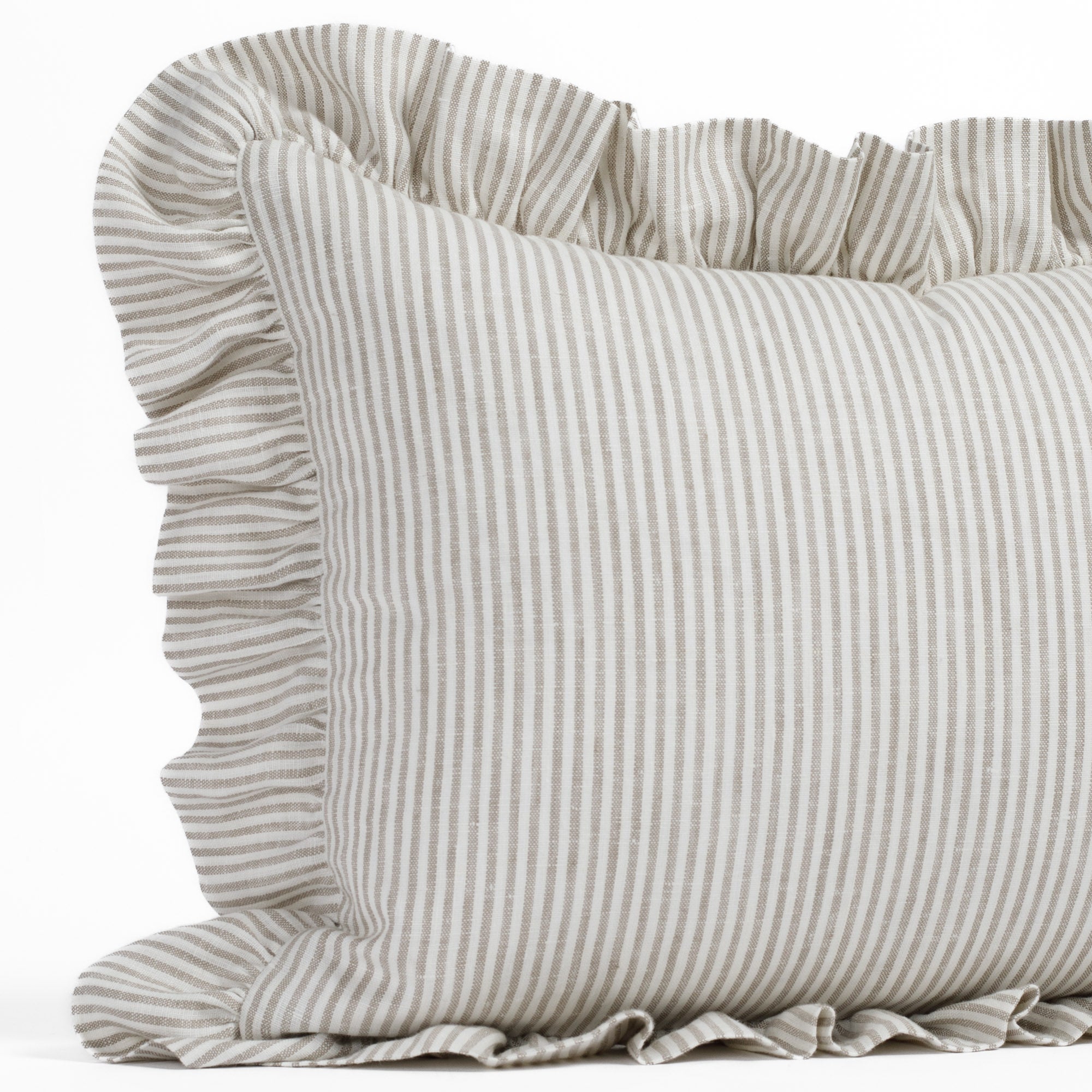 Detail shot of Tonic Living’s Siena decorative ruffle lumbar pillow, highlighting the soft neutral tones and romantic ruffle edge in a warm beige and ivory palette.