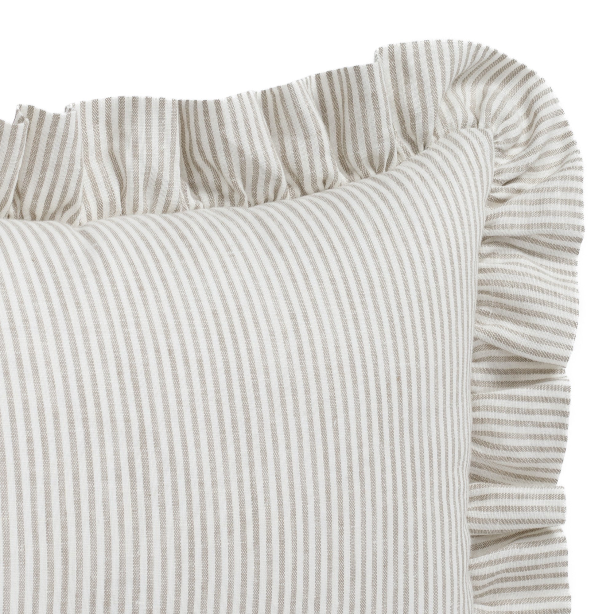 Close-up of the Siena Buff ruffled lumbar toss cushion by Tonic Living, showing the stitched vertical pinstripe and airy 100% linen weave with fine slub texture.