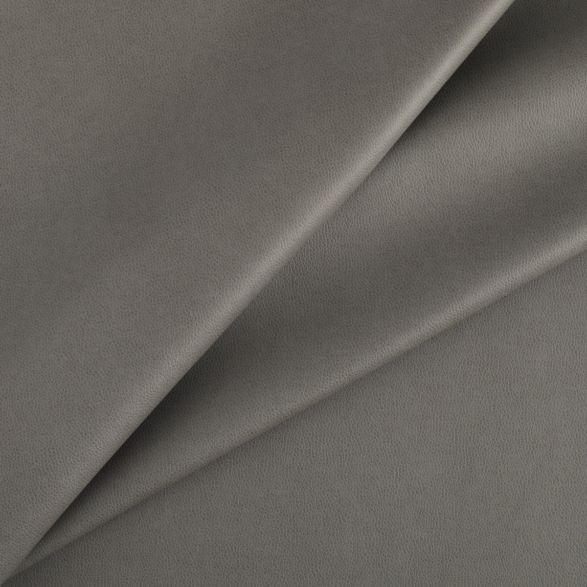 Tonic Living Smythe Charcoal high-performance faux leather fabric featuring a deep charcoal colour and natural-looking grain.