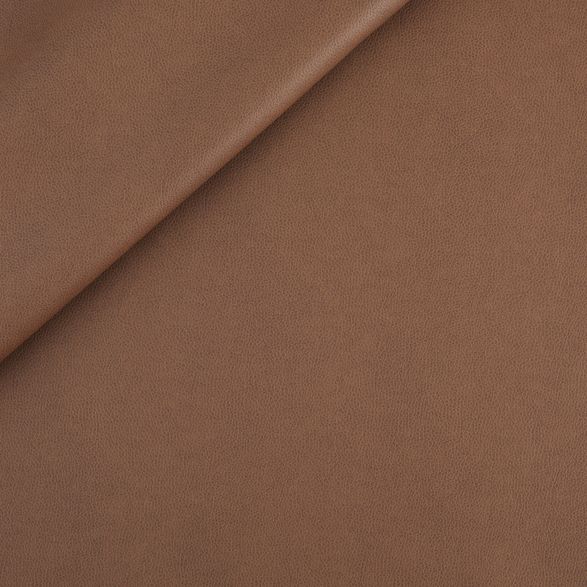 Tonic Living Smythe Faux Leather Fabric in Cognac, a deep cognac brown high-performance upholstery fabric with a natural leather look.