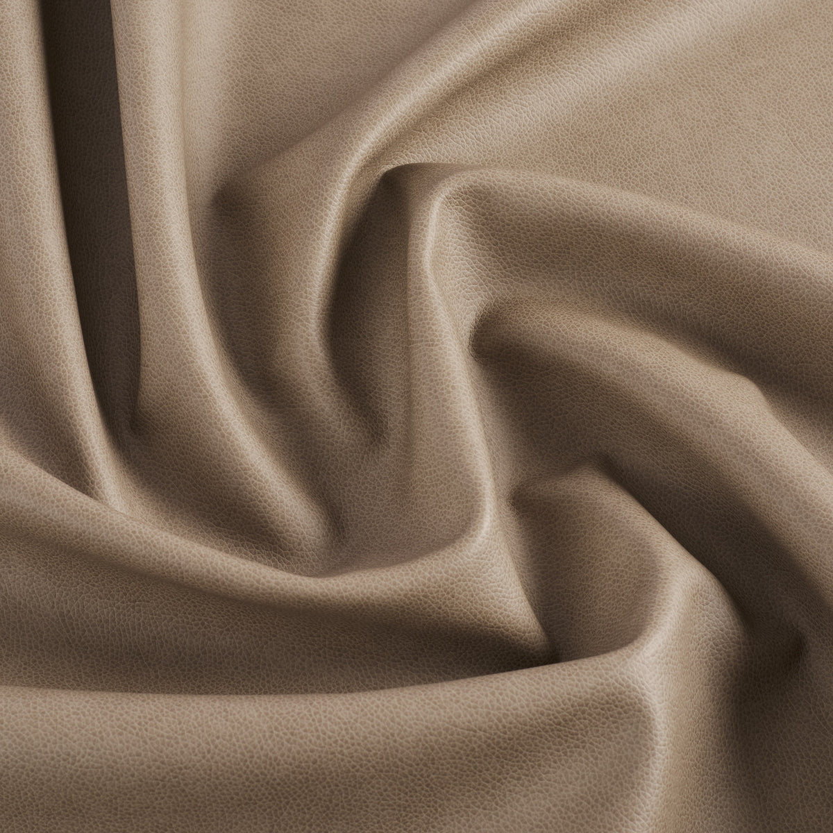 Tonic Living Smythe Faux Leather Fabric in Portobello, a taupe brown performance upholstery fabric with the rich character of genuine leather.