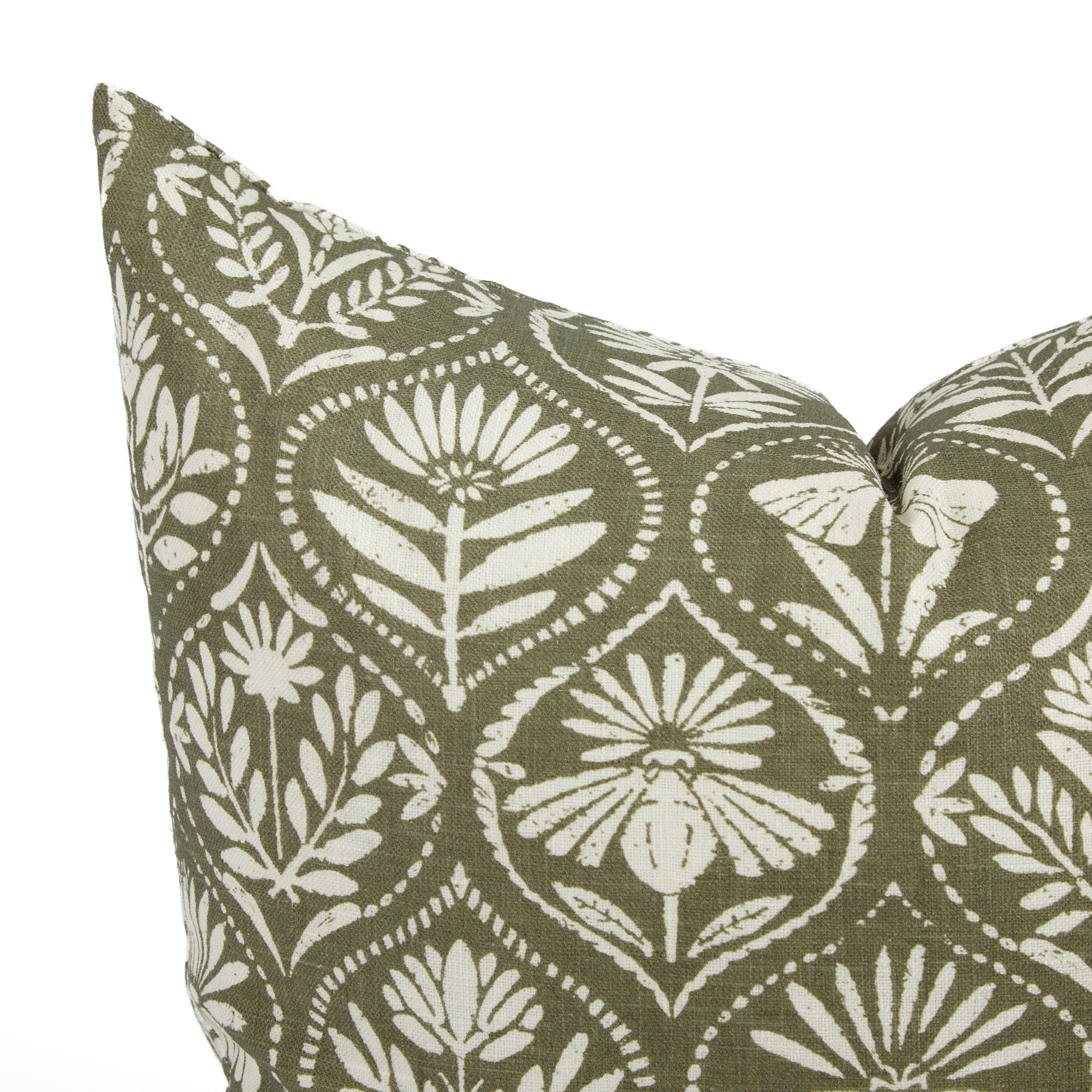 Close up of Tonic Living Stella Evergreen cushion showing dark olive green, beige, and natural floral medallion detail.