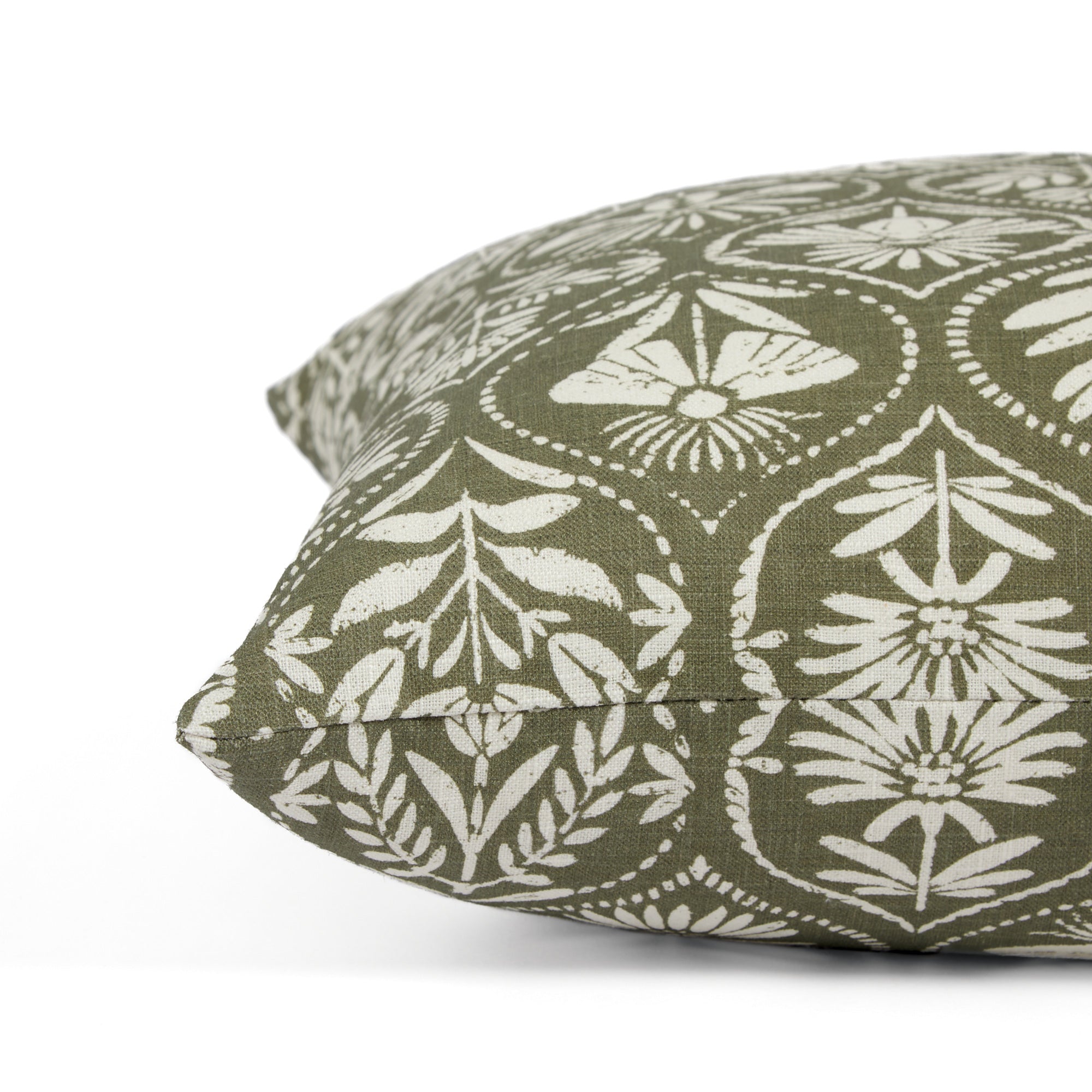 Side view of Tonic Living Stella Evergreen decorative pillow highlighting its floral block print medallion pattern.