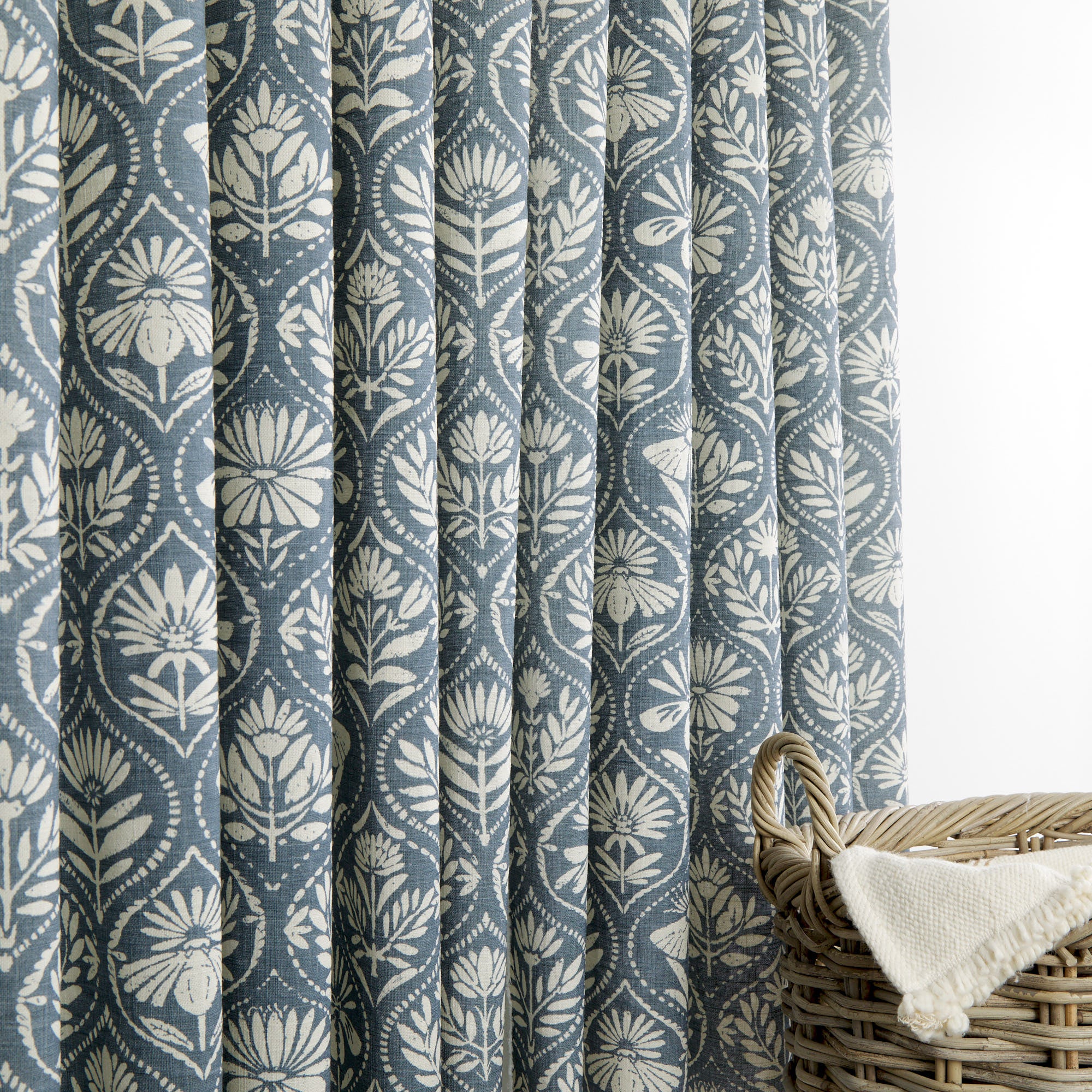 Tonic Living Stella Harbour Blue curtain fabric shown as drapery in blue and beige block print design.