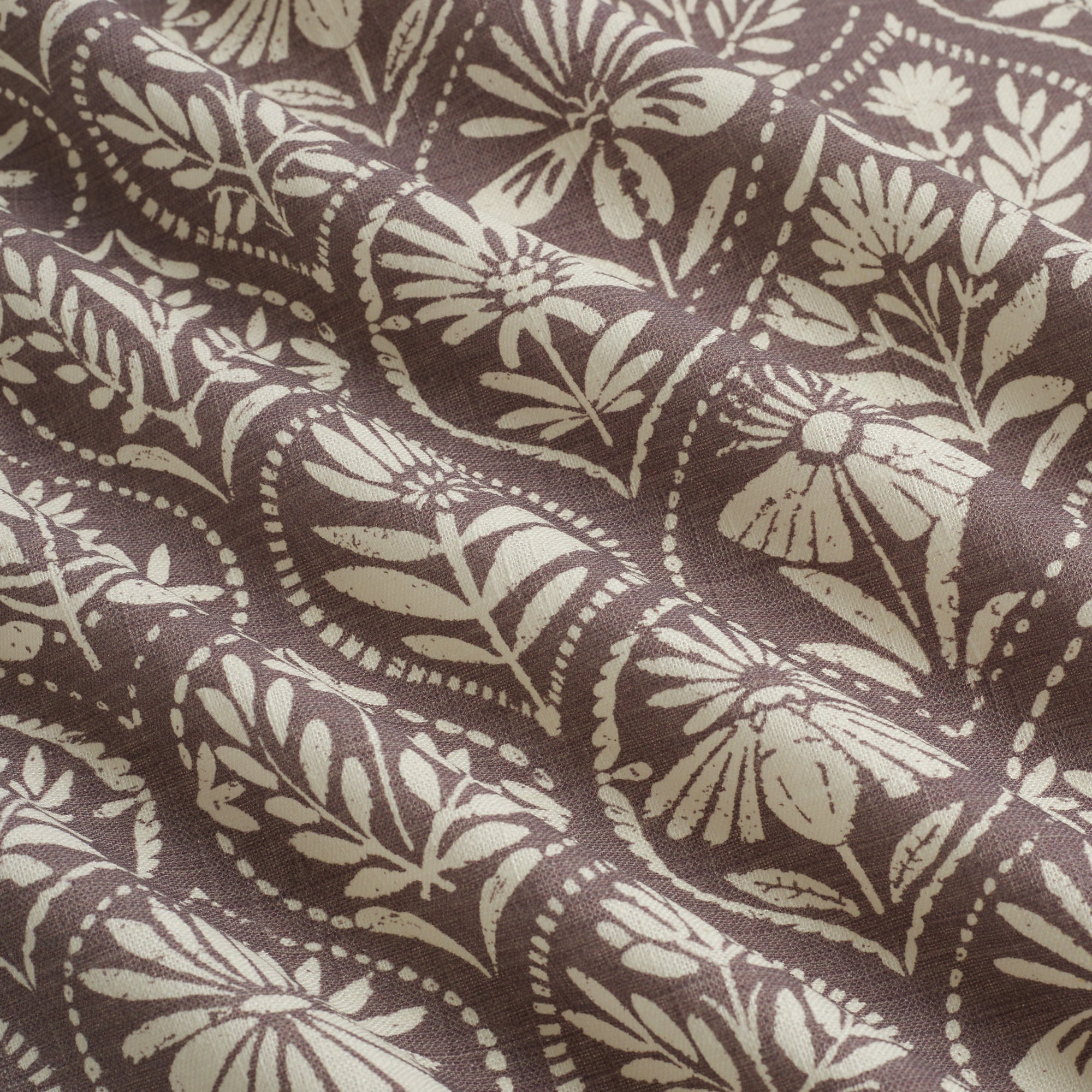 Tonic Living Stella Mauve drapery fabric shown with movement highlighting mauve and beige medallion pattern.